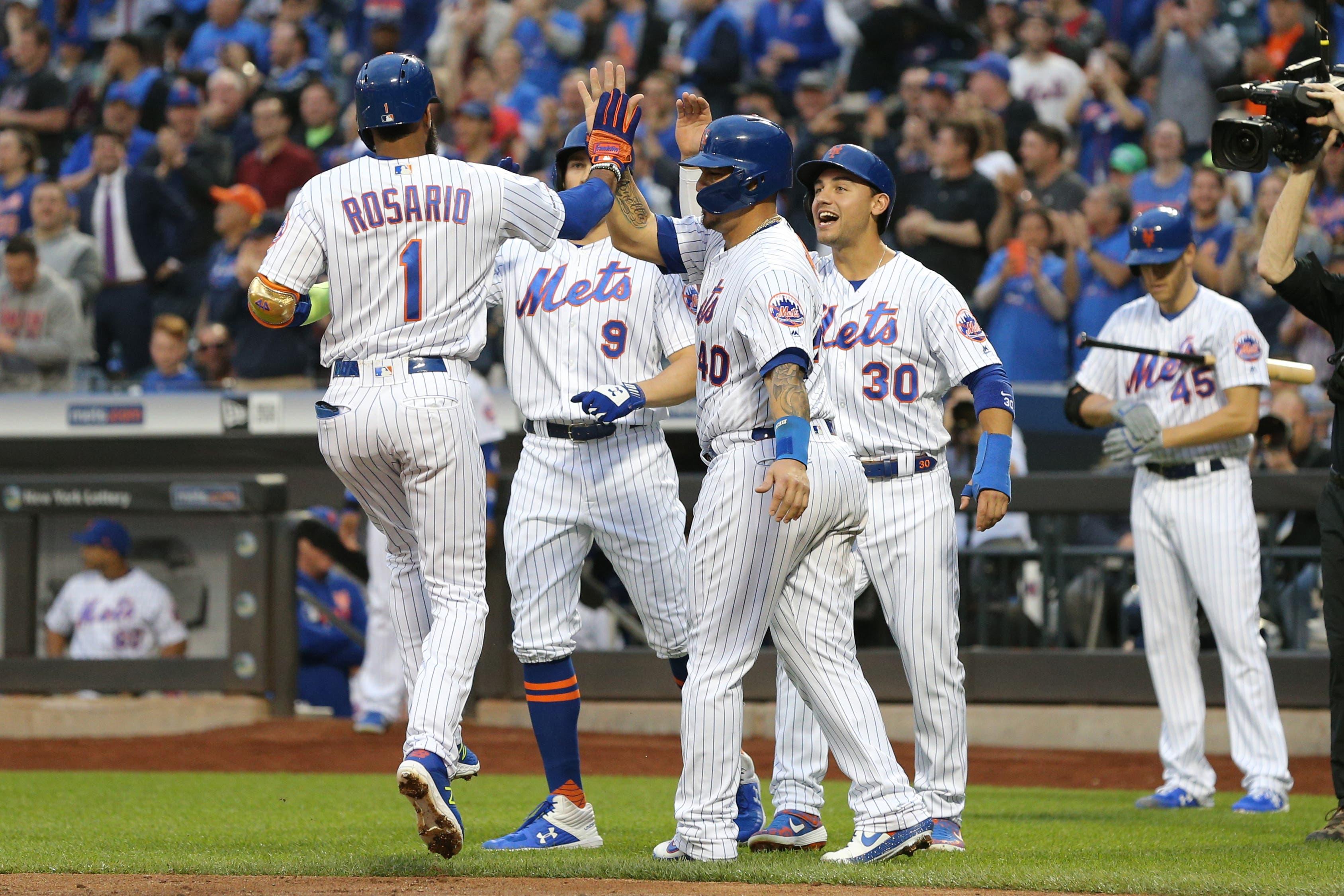 May 10, 2019; New York City, NY, USA; New York Mets shortstop Amed Rosario (1) is greeted at home plate by catcher Wilson Ramos (40) and center fielder Brandon Nimmo (9) and right fielder Michael Conforto (30) after hitting a grand slam home run against the Miami Marlins during the first inning at Citi Field. Mandatory Credit: Brad Penner-USA TODAY Sports / Brad Penner