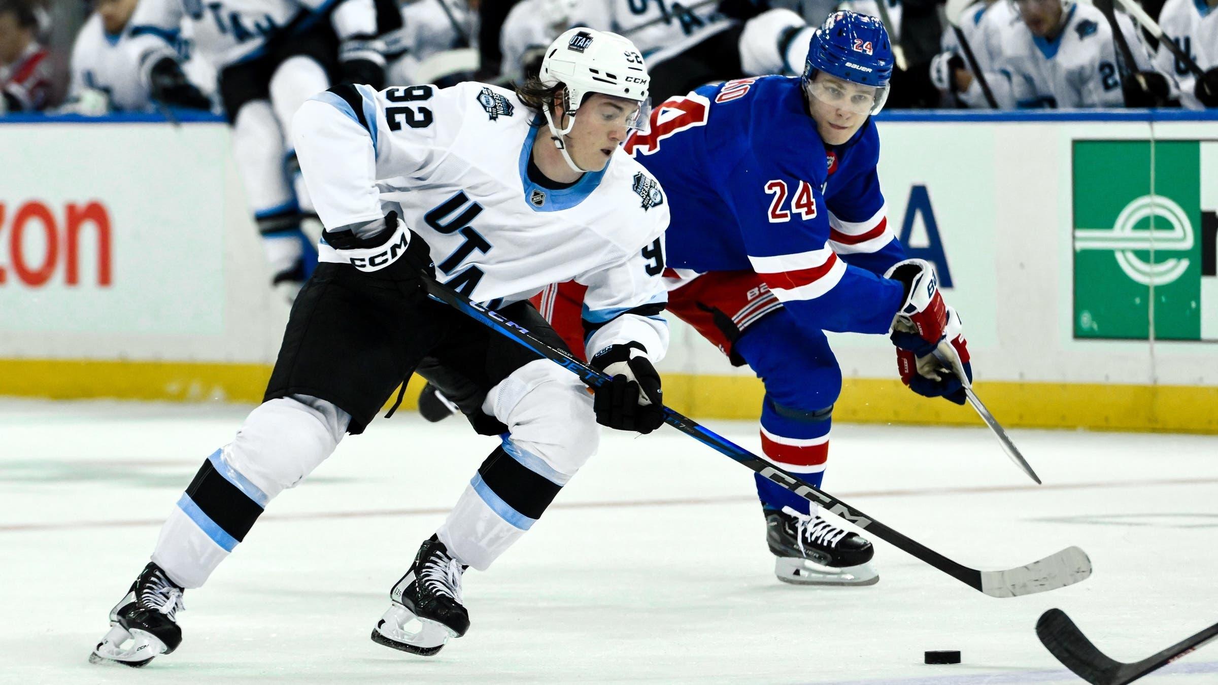 Utah Hockey Club center Logan Cooley (92) skates with the puck against New York Rangers right wing Kaapo Kakko (24) during the third period at Madison Square Garden.