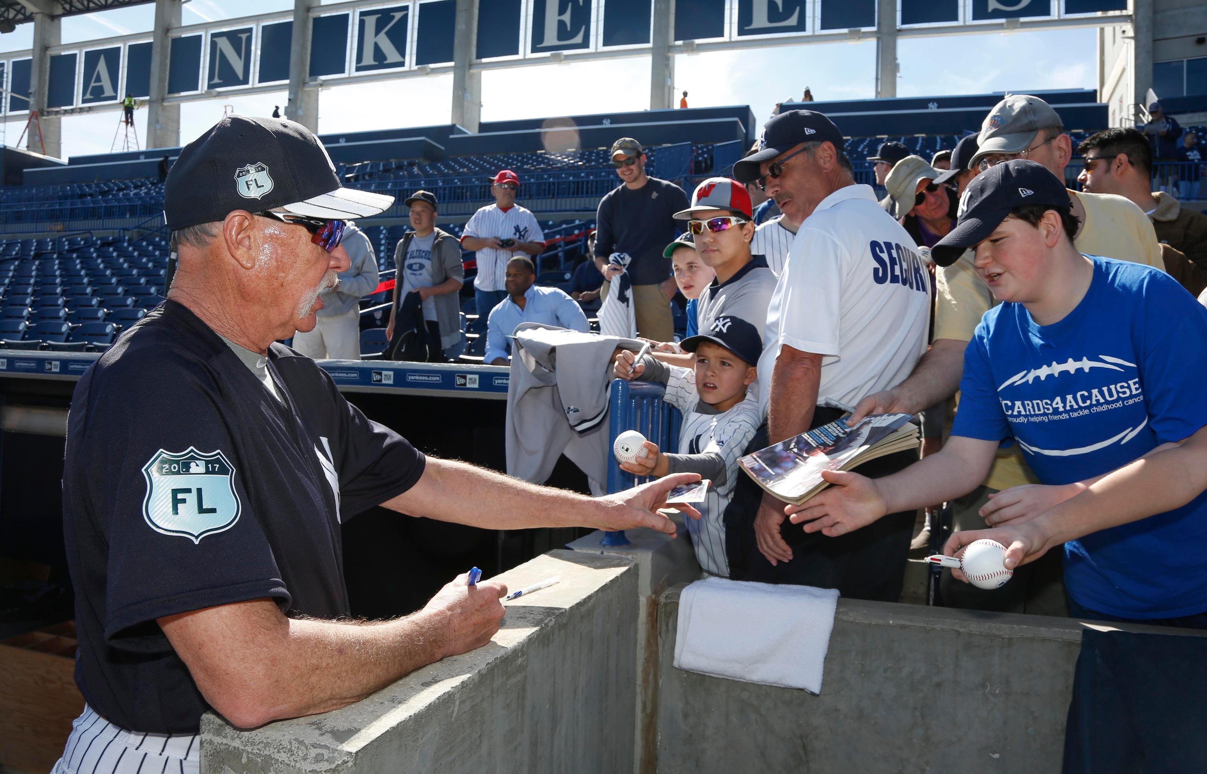 New York Yankees instructor Goose Gossage signs autographs during MLB spring training workouts at George M. Steinbrenner Field. / Reinhold Matay/USA TODAY Sports