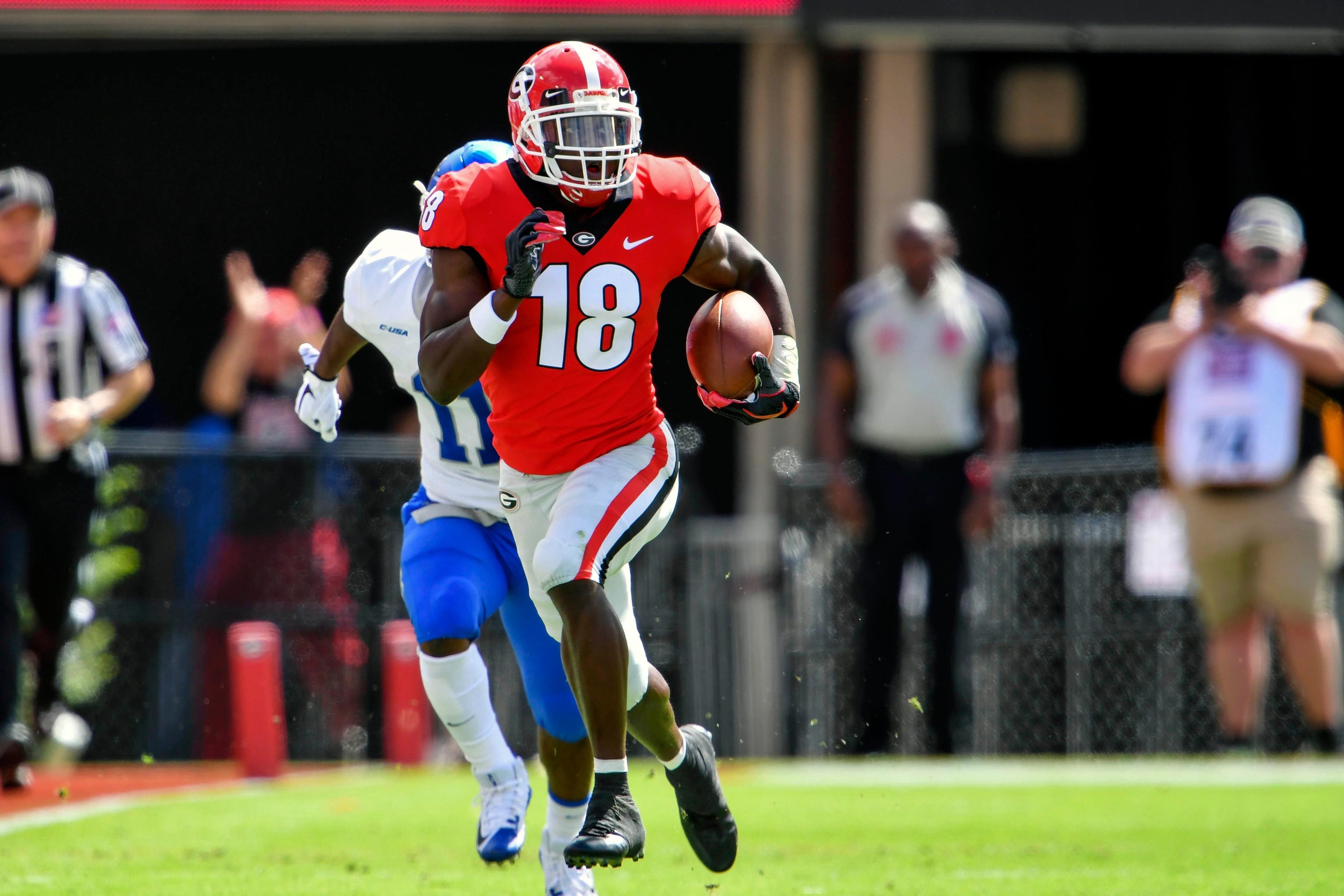 Sep 15, 2018; Athens, GA, USA; Georgia Bulldogs defensive back Deandre Baker (18) returns an interception against the Middle Tennessee Blue Raiders during the first quarter at Sanford Stadium. Mandatory Credit: Dale Zanine-USA TODAY Sports / Dale Zanine