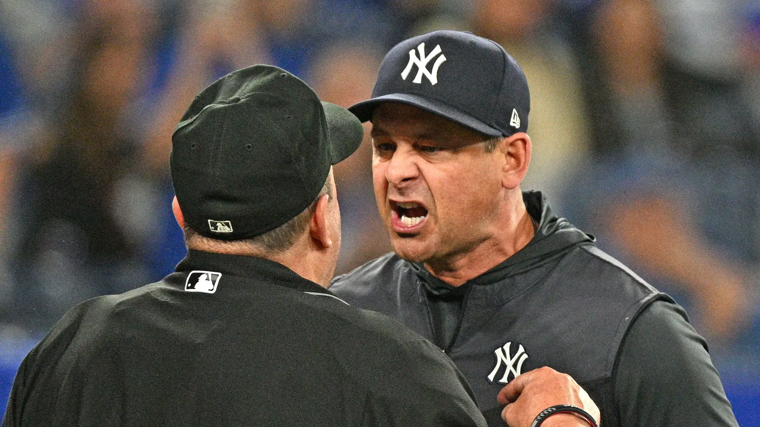 May 4, 2022; Toronto, Ontario, CAN; New York Yankees manager Aaron Boone (17) argues pitch calls with home plate umpire Marty Foster before being ejected from the game in the eighth inning against the Toronto Blue Jays at Rogers Centre. / Dan Hamilton-USA TODAY Sports