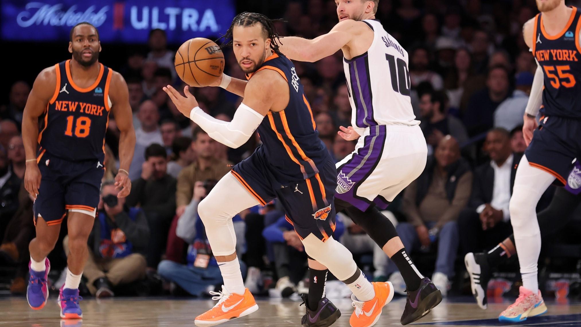 Apr 4, 2024; New York, New York, USA; New York Knicks guard Jalen Brunson (11) brings the ball up court after a steal against Sacramento Kings forward Domantas Sabonis (10) during the second quarter at Madison Square Garden. / Brad Penner-USA TODAY Sports
