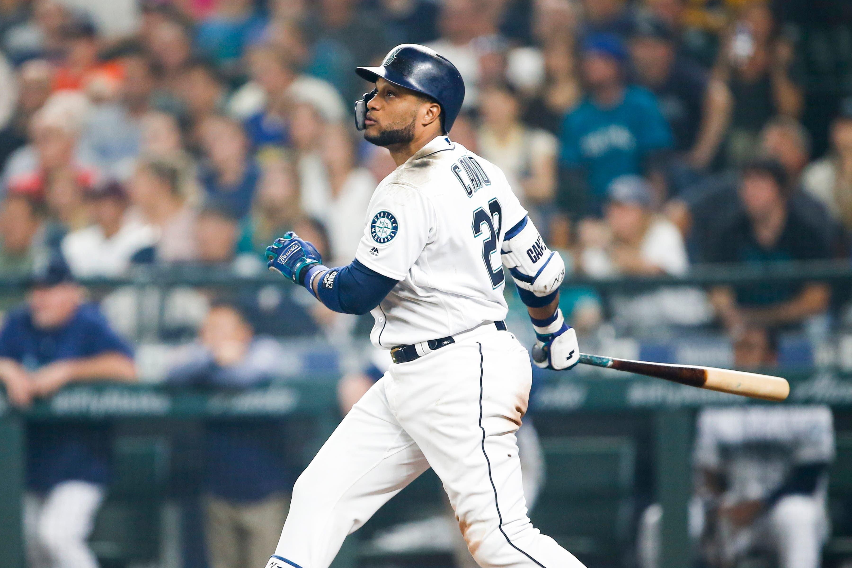 Seattle Mariners first baseman Robinson Cano hits a three-run homer against the Houston Astros during the eighth inning at Safeco Field. / Joe Nicholson/USA TODAY Sports