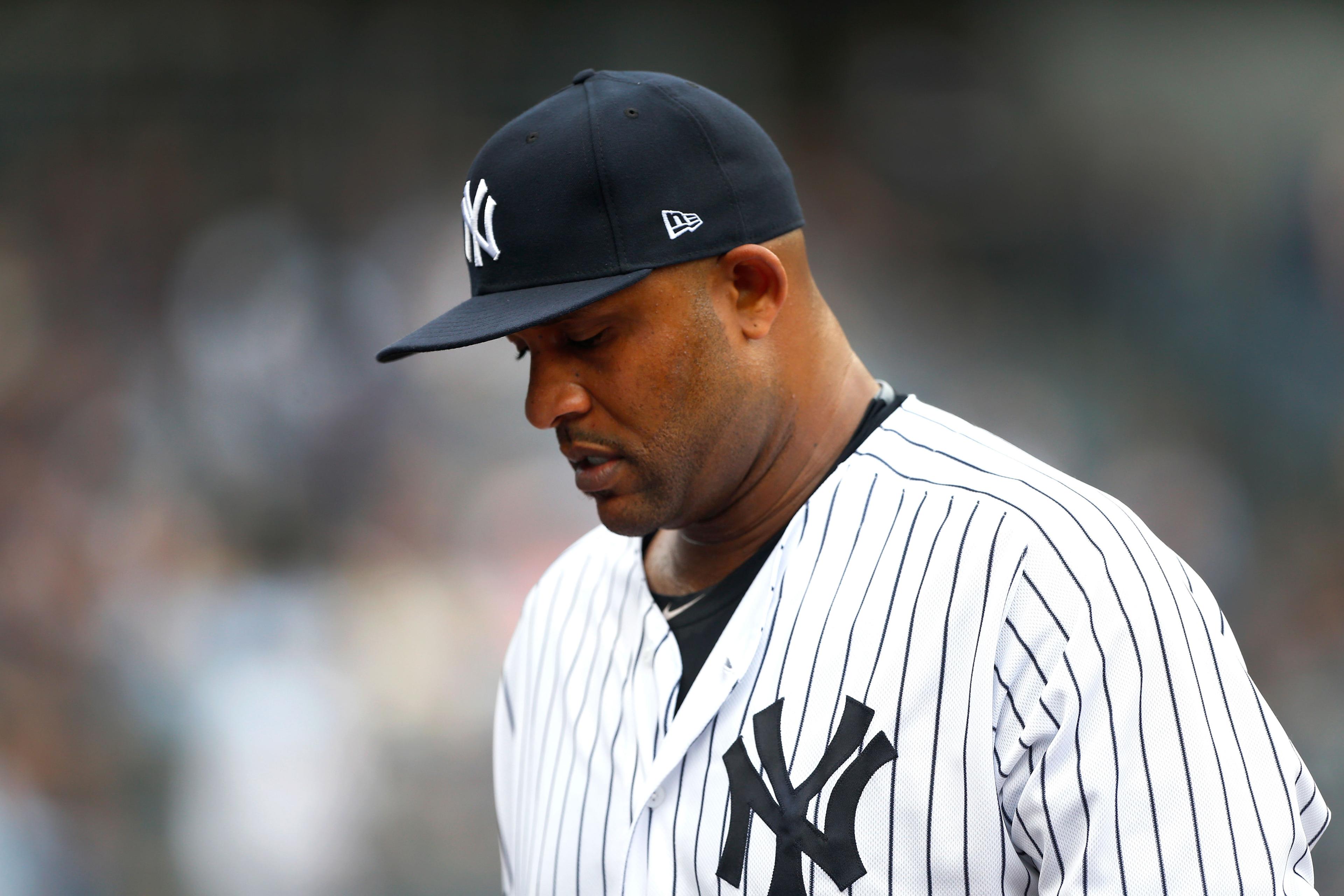 Jun 19, 2019; Bronx, NY, USA; New York Yankees starting pitcher CC Sabathia (52) goes to the dugout between innings at Yankee Stadium. Mandatory Credit: Noah K. Murray-USA TODAY Sports