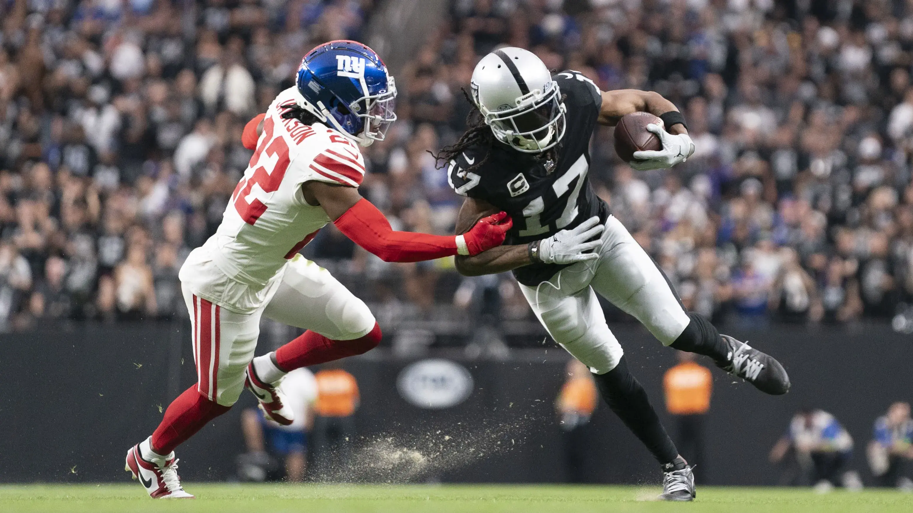 November 5, 2023; Paradise, Nevada, USA; Las Vegas Raiders wide receiver Davante Adams (17) runs the football against New York Giants cornerback Adoree' Jackson (22) during the second quarter at Allegiant Stadium. Mandatory Credit: Kyle Terada-USA TODAY Sports / © Kyle Terada-USA TODAY Sports