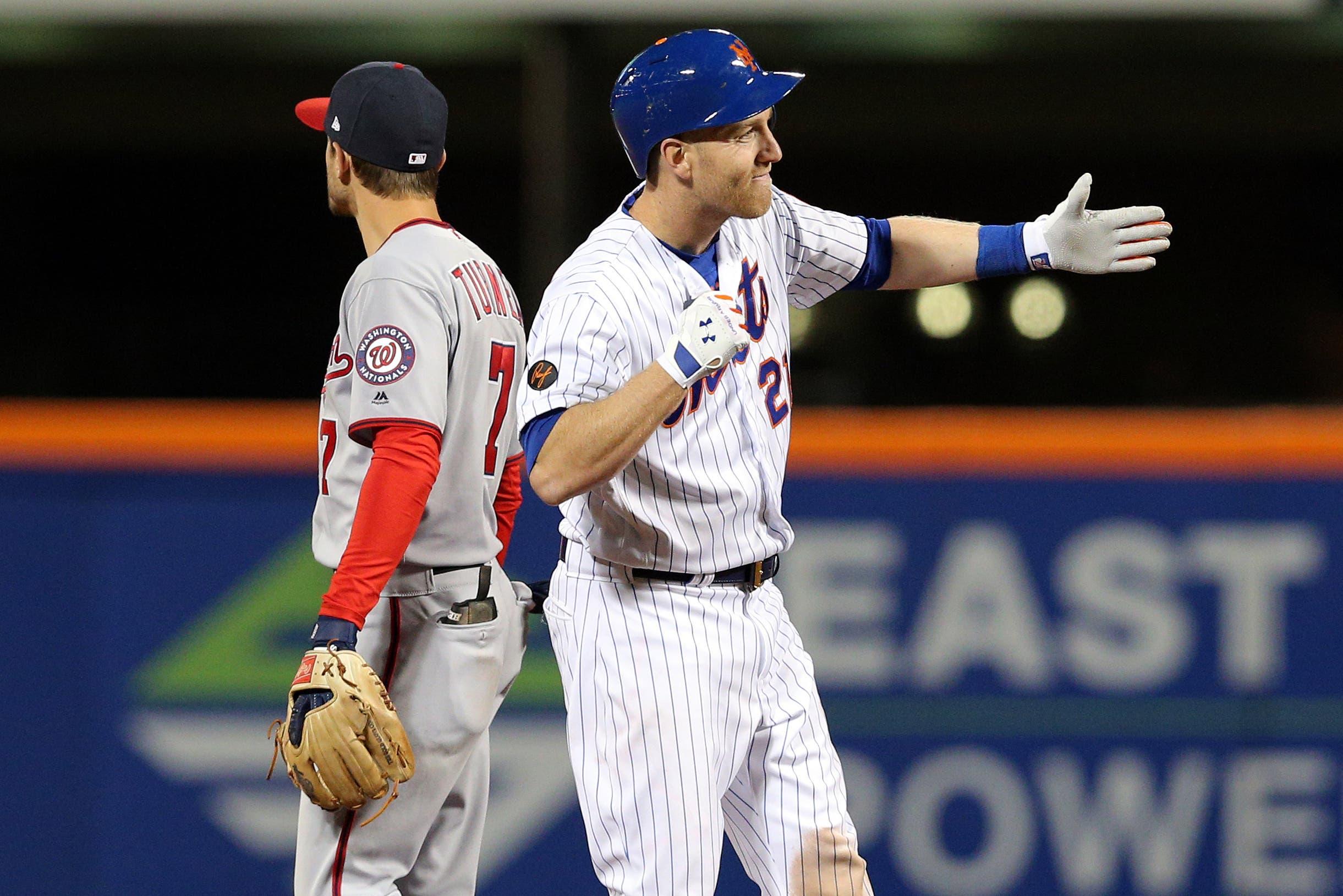 Apr 18, 2018; New York City, NY, USA; New York Mets third baseman Todd Frazier (21) celebrates his two run single against the Washington Nationals during the eighth inning at Citi Field. Mandatory Credit: Brad Penner-USA TODAY Sports / Brad Penner