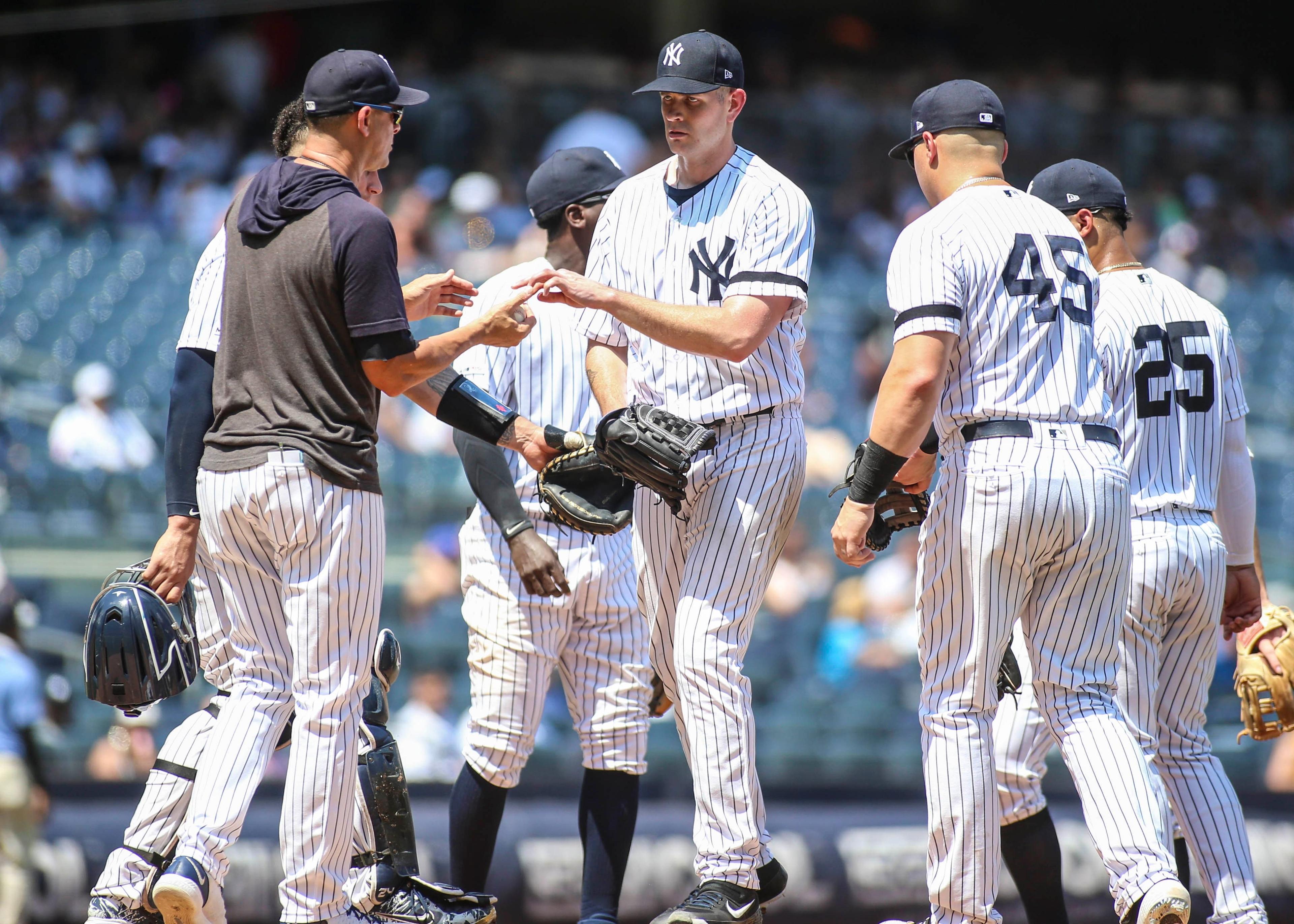 Jul 21, 2019; Bronx, NY, USA; New York Yankees manager Aaron Boone (17) takes out pitcher James Paxton (65) in the fourth inning against the Colorado Rockies at Yankee Stadium. Mandatory Credit: Wendell Cruz-USA TODAY Sports / Wendell Cruz