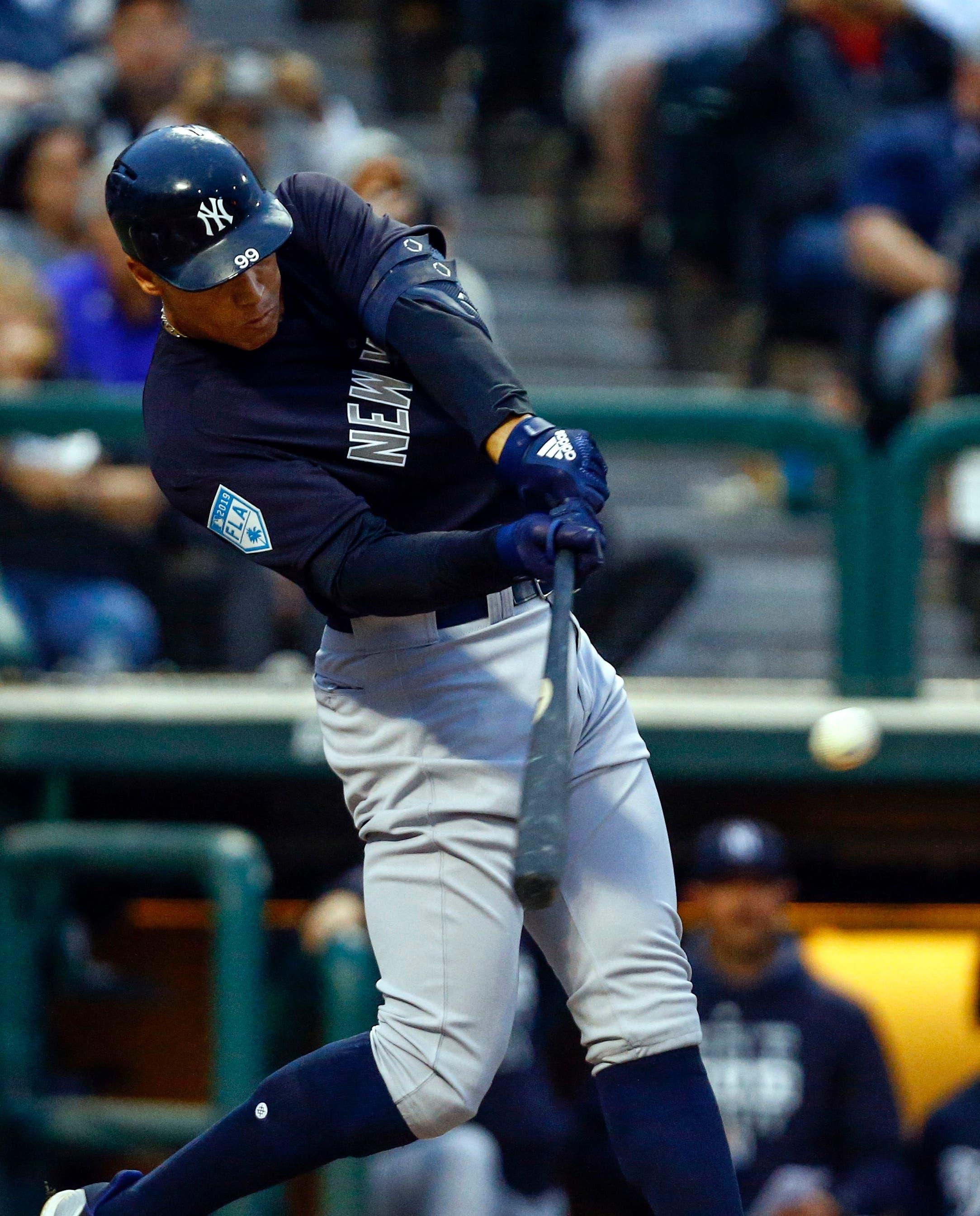 Mar 18, 2019; Lake Buena Vista, FL, USA; New York Yankees right fielder Aaron Judge (99) hits a two run triple during the fifth inning against the Atlanta Braves at Champion Stadium. Mandatory Credit: Butch Dill-USA TODAY Sports / Butch Dill