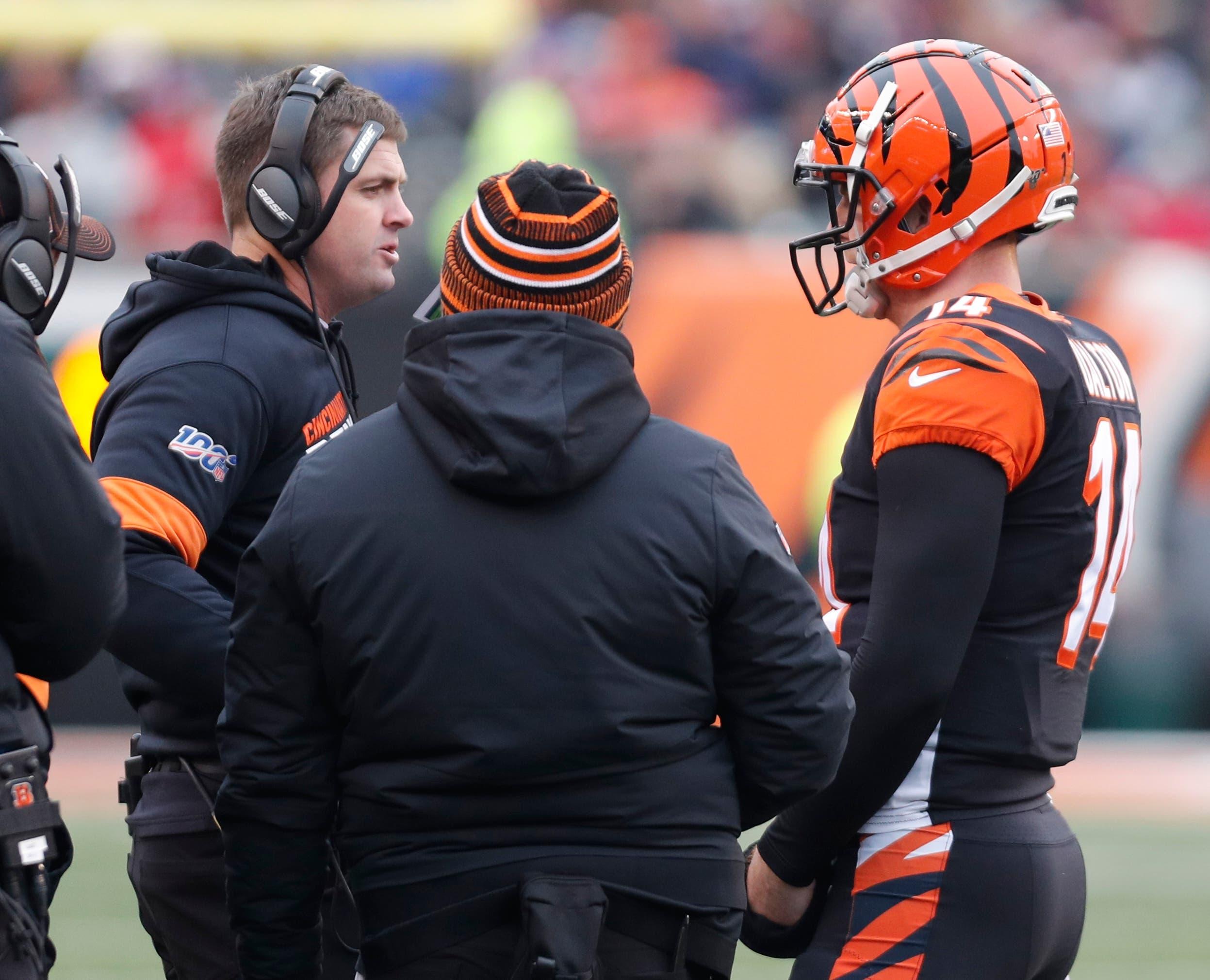 Dec 15, 2019; Cincinnati, OH, USA; Cincinnati Bengals head coach Zac Taylor (left) talks with quarterback Andy Dalton (14) during the second half against the New England Patriots at Paul Brown Stadium. Mandatory Credit: David Kohl-USA TODAY Sports / David Kohl