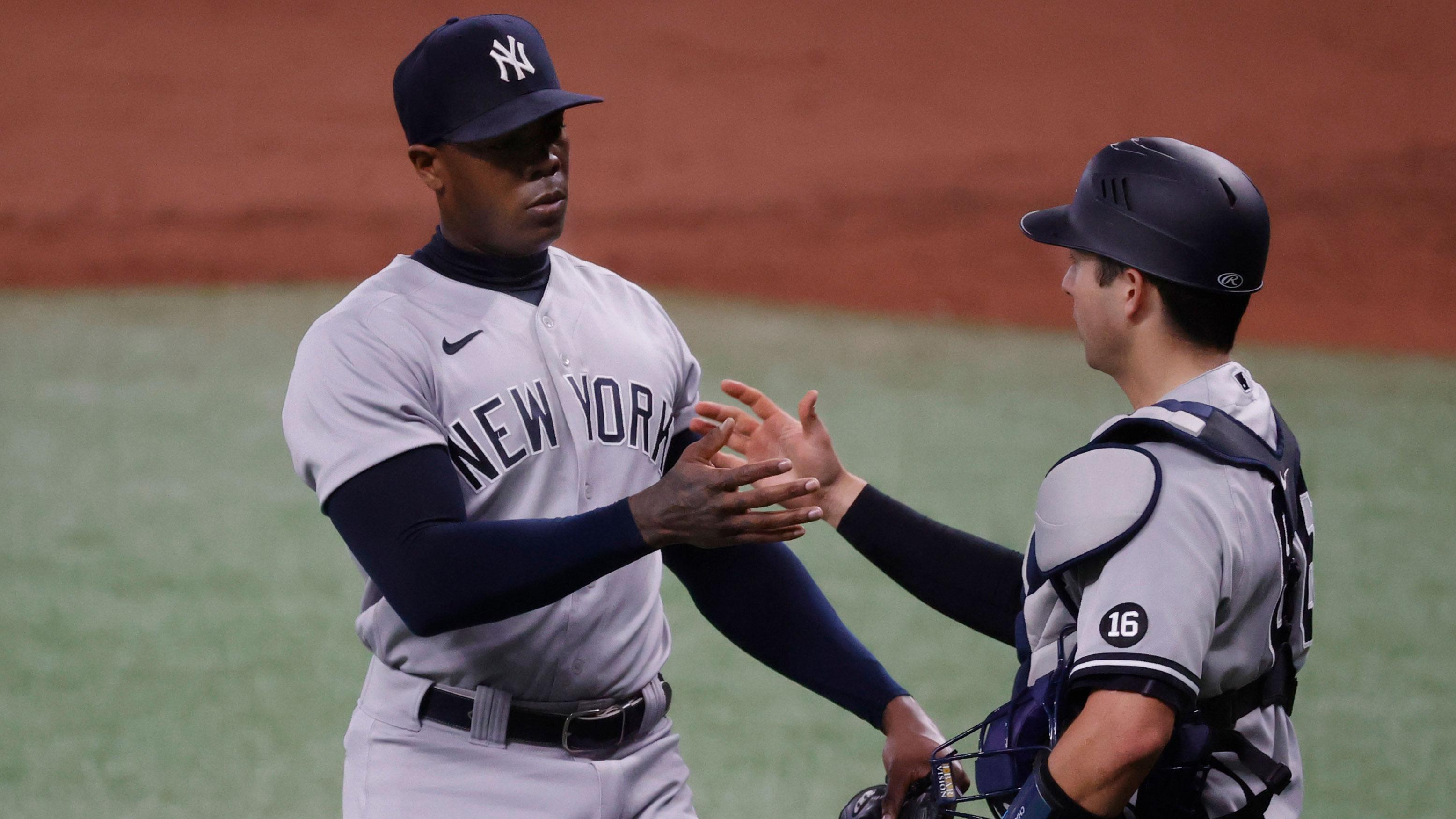 May 12, 2021; St. Petersburg, Florida, USA; New York Yankees relief pitcher Aroldis Chapman (54) and New York Yankees catcher Kyle Higashioka (66) high five as they beat the Tampa Bay Rays at Tropicana Field / Kim Klement-USA TODAY Sports