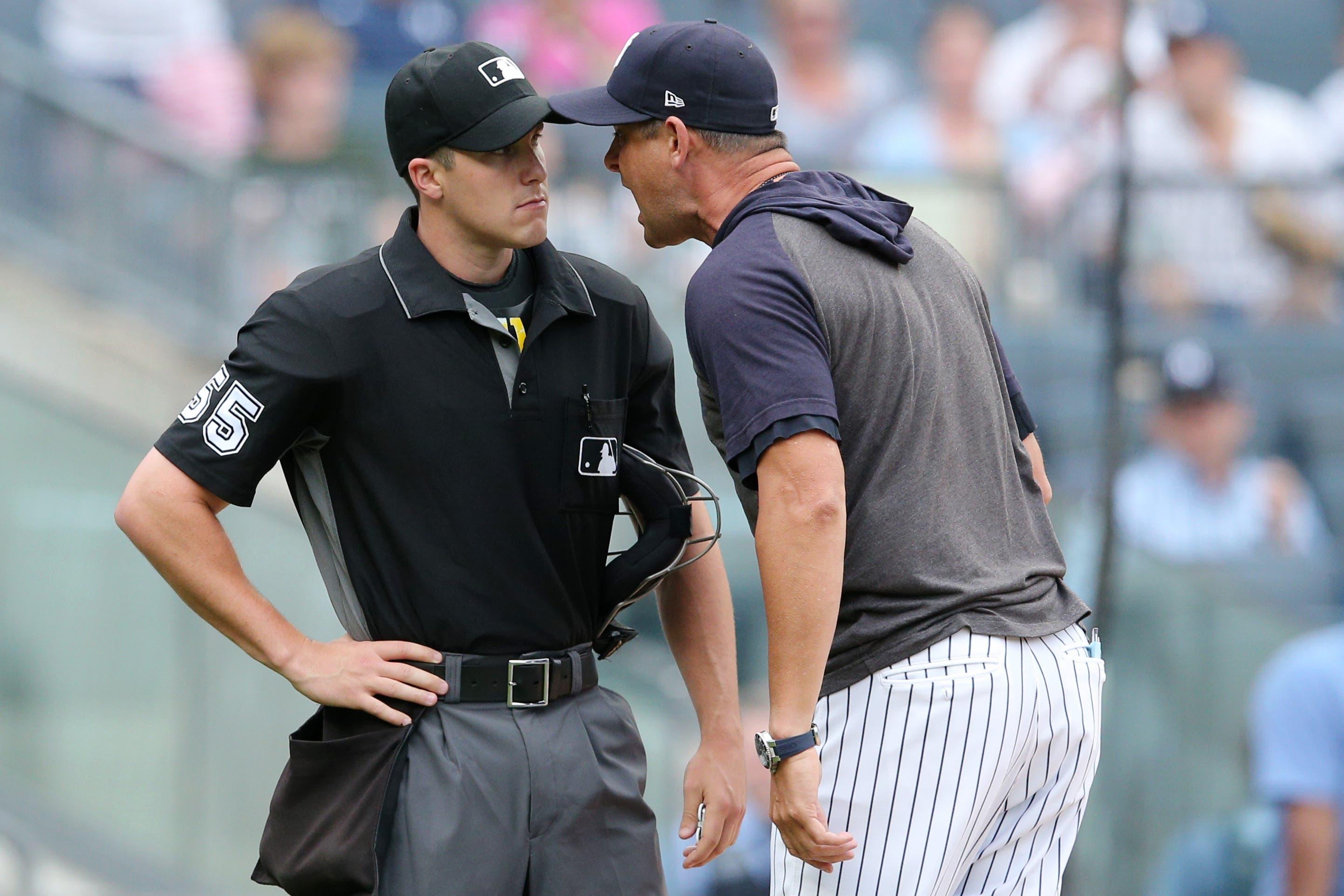 Jul 18, 2019; Bronx, NY, USA; New York Yankees manager Aaron Boone (17) argues with home plate umpire Brennan Miller (55) after being ejected during the second inning of the first game of a doubleheader against the Tampa Bay Rays at Yankee Stadium. Mandatory Credit: Brad Penner-USA TODAY Sports / Brad Penner