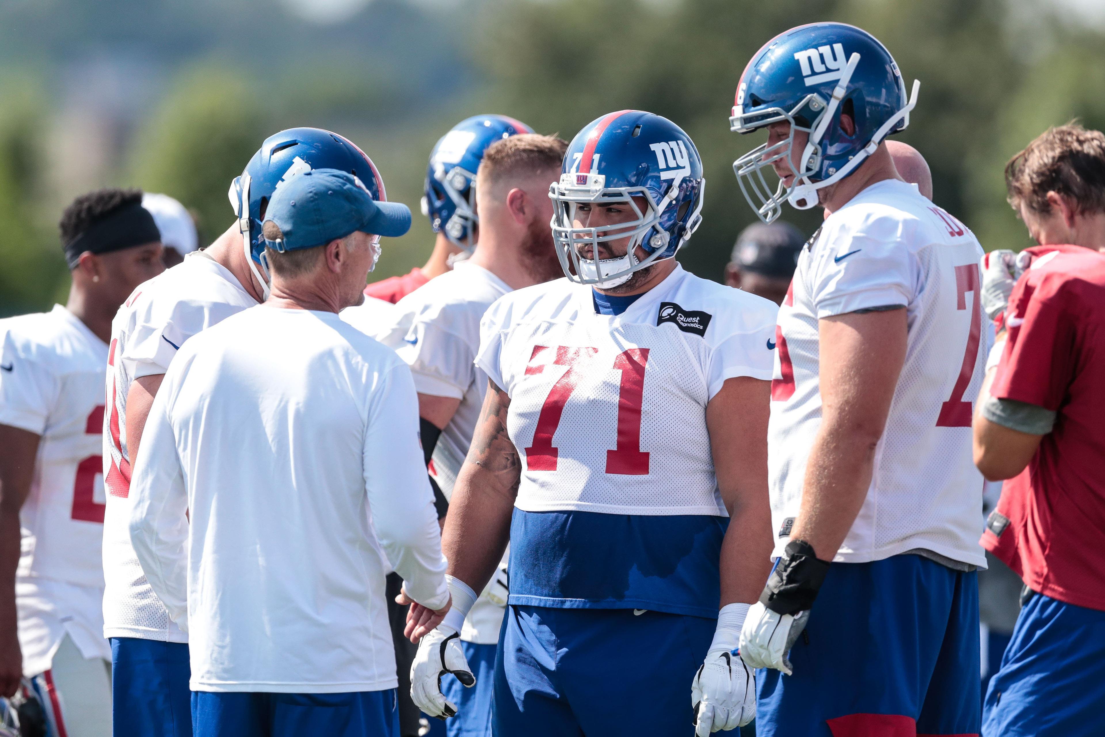 Jul 25, 2019; East Rutherford, NJ, USA; New York Giants offensive guard Will Hernandez (71) and offensive tackle Nate Solder (76) talk with head coach Pat Shurmur during the first day of training camp at Quest Diagnostics Training Center. Mandatory Credit: Vincent Carchietta-USA TODAY Sports / Vincent Carchietta