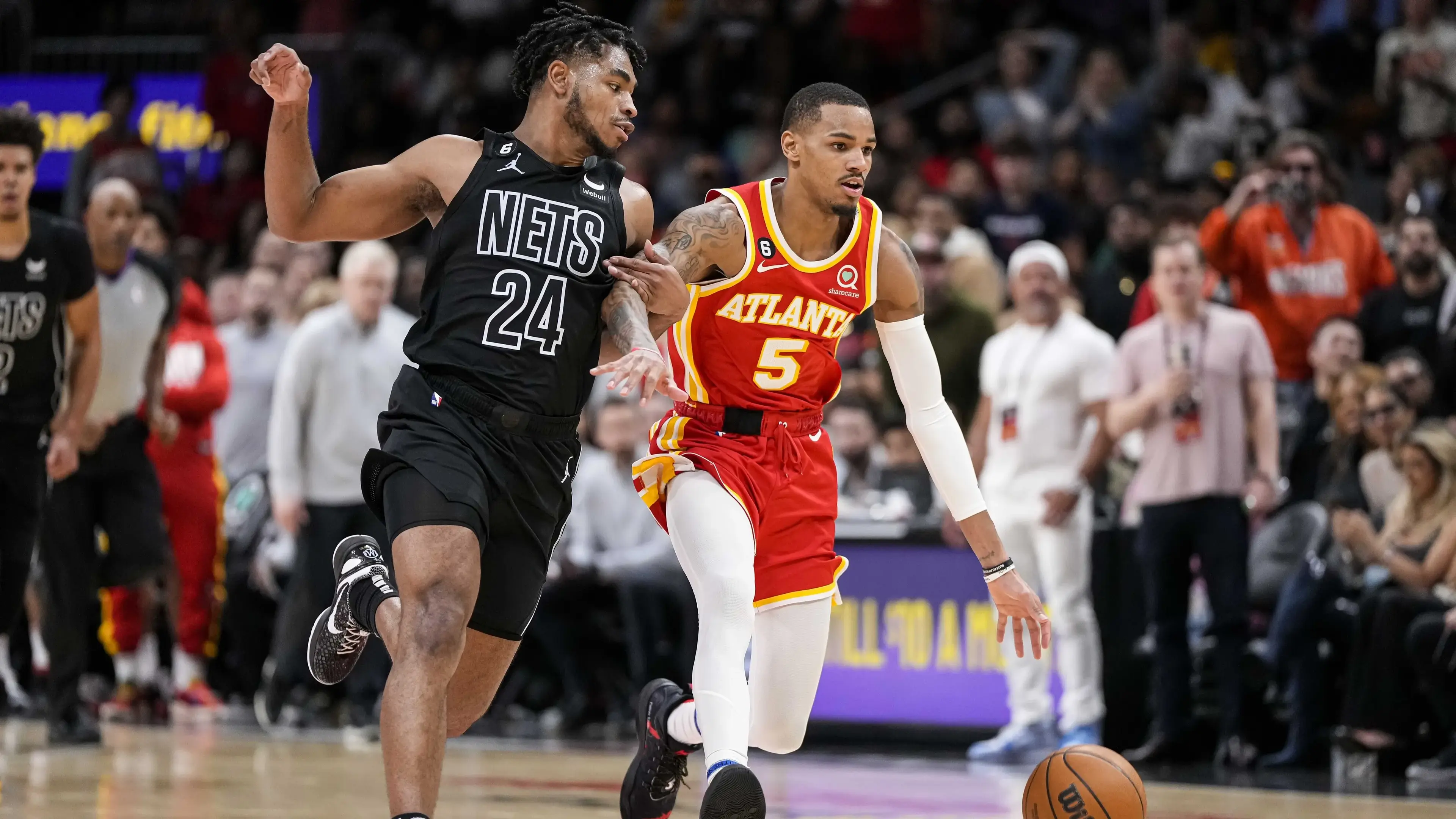 Feb 26, 2023; Atlanta, Georgia, USA; Atlanta Hawks guard Dejounte Murray (5) dribbles against Brooklyn Nets guard Cam Thomas (24) during the second half at State Farm Arena. / Dale Zanine-USA TODAY Sports