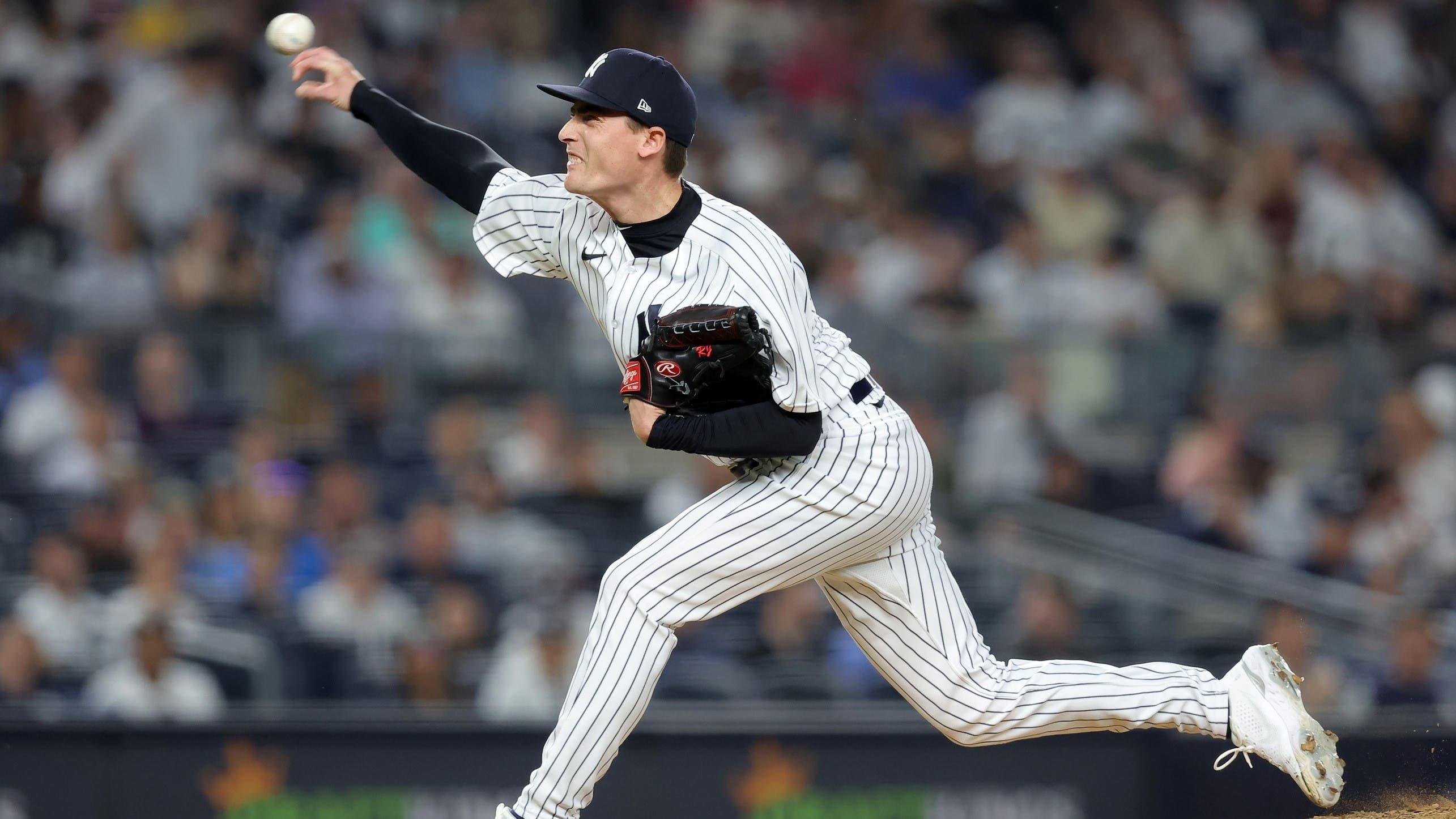 May 11, 2023; Bronx, New York, USA; New York Yankees relief pitcher Ron Marinaccio (97) pitches against the Tampa Bay Rays during the sixth inning at Yankee Stadium.