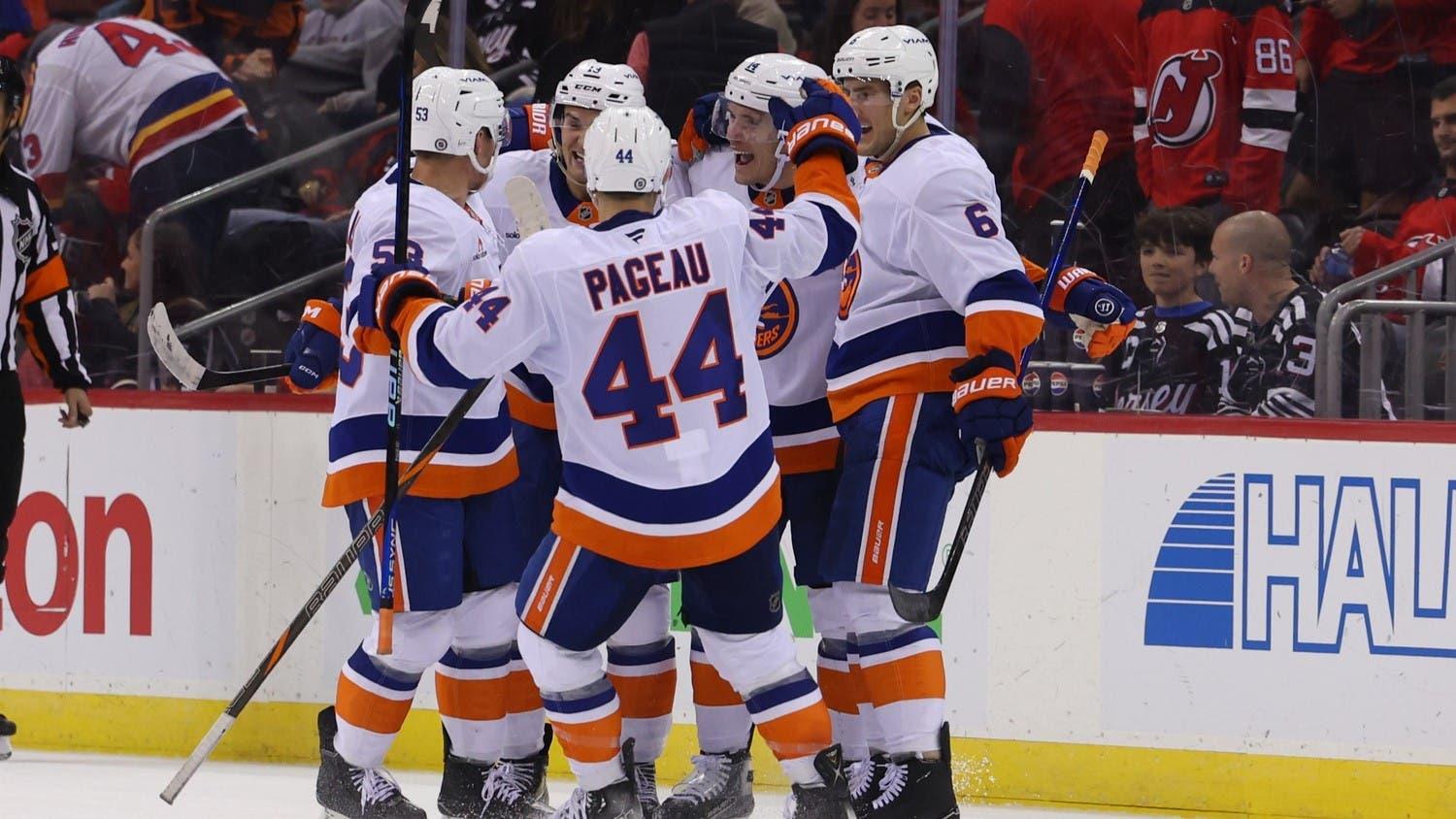 Oct 25, 2024; Newark, New Jersey, USA; New York Islanders center Bo Horvat (14) celebrates his game winning goal against the New Jersey Devils in overtime at Prudential Center. / Ed Mulholland-Imagn Images