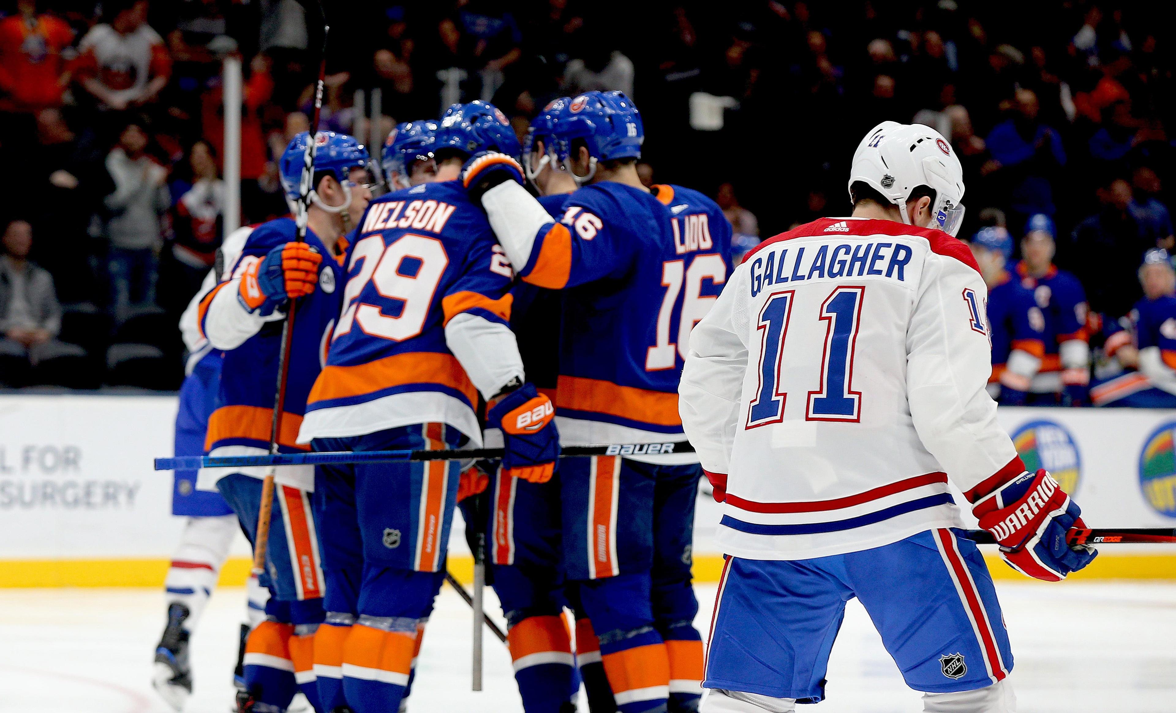 Mar 14, 2019; Uniondale, NY, USA; Montreal Canadiens right wing Brendan Gallagher (11) skates away as the New York Islanders celebrate a goal during the second period at Nassau Veterans Memorial Coliseum. Mandatory Credit: Andy Marlin-USA TODAY Sports / Andy Marlin