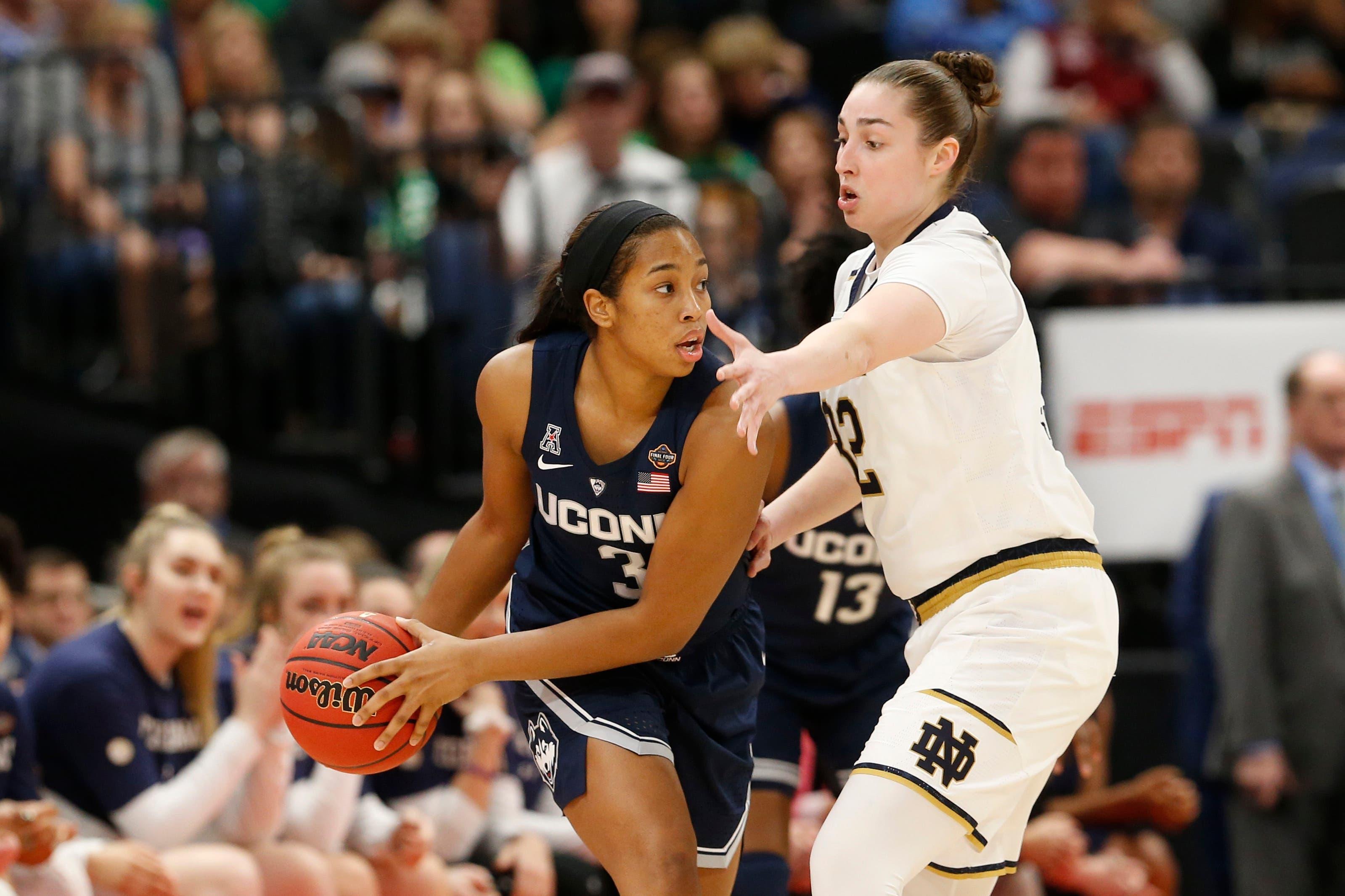 Apr 5, 2019; Tampa, FL, USA; UConn Huskies guard Megan Walker (3) controls the ball as Notre Dame Fighting Irish forward Jessica Shepard (32) defends during the first half in the semifinals of the women's Final Four of the 2019 NCAA Tournament at Amalie Arena. Mandatory Credit: Kim Klement-USA TODAY Sportsundefined