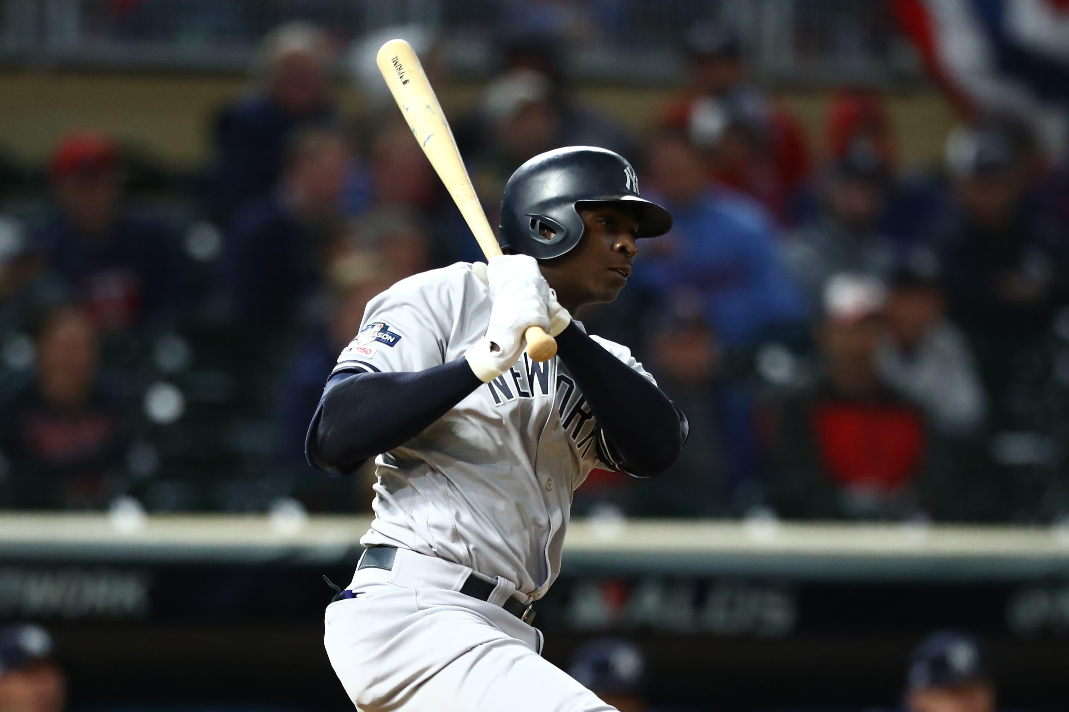 Oct 7, 2019; Minneapolis, MN, USA; New York Yankees shortstop Didi Gregorius (18) hits an RBI single during the ninth inning of game three of the 2019 ALDS playoff baseball series against the Minnesota Twins at Target Field. Mandatory Credit: David Berding-USA TODAY Sports / David Berding