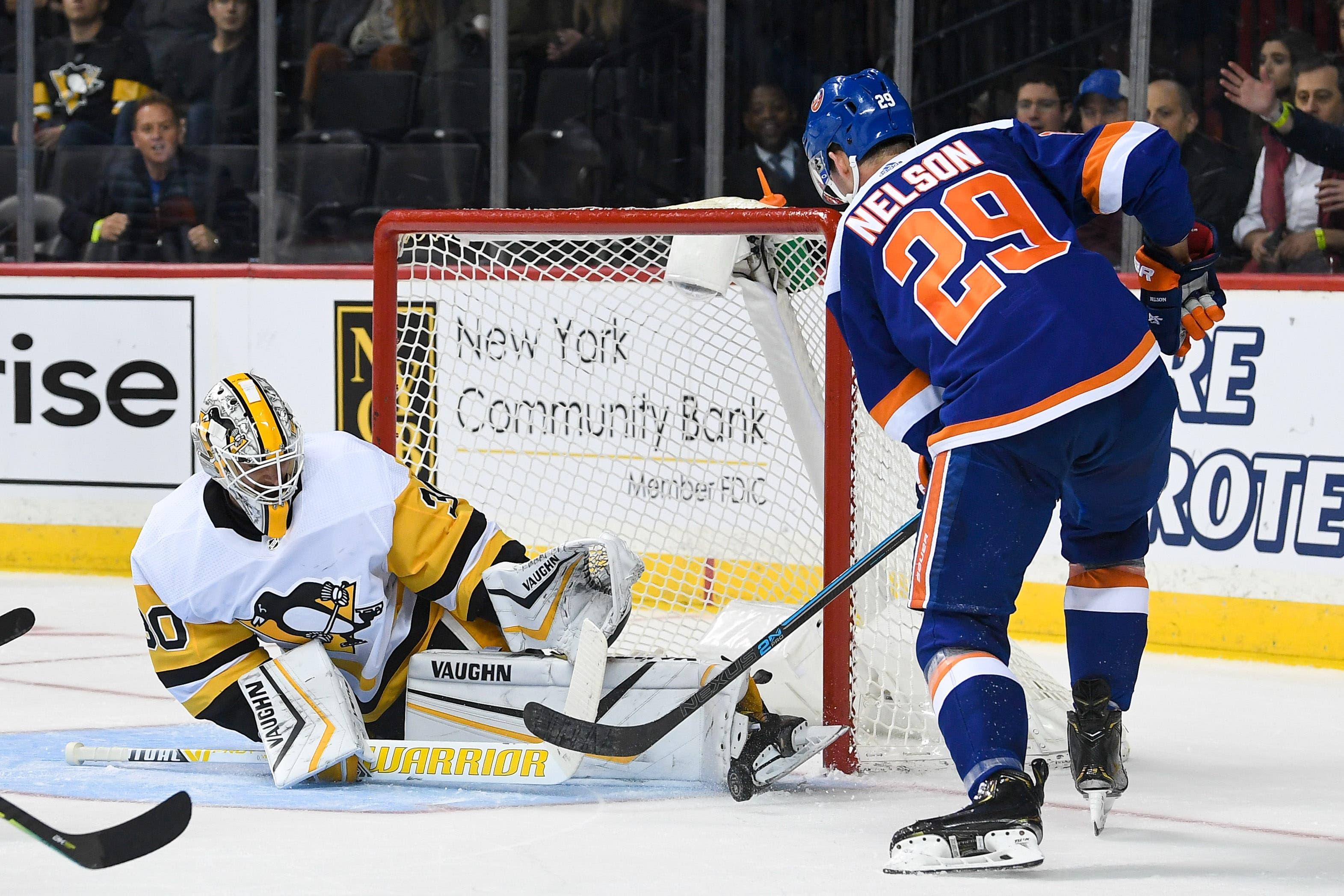 Nov 7, 2019; Brooklyn, NY, USA; Pittsburgh Penguins goaltender Matt Murray (30) makes a save against New York Islanders center Brock Nelson (29) during the second period at Barclays Center. Mandatory Credit: Dennis Schneidler-USA TODAY Sports / Dennis Schneidler