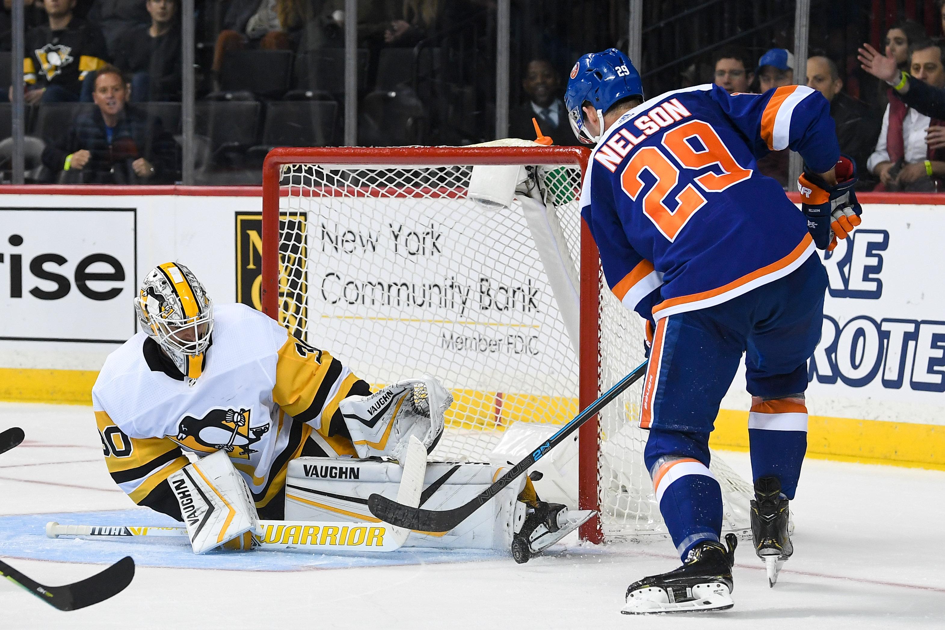 Nov 7, 2019; Brooklyn, NY, USA; Pittsburgh Penguins goaltender Matt Murray (30) makes a save against New York Islanders center Brock Nelson (29) during the second period at Barclays Center. Mandatory Credit: Dennis Schneidler-USA TODAY Sports