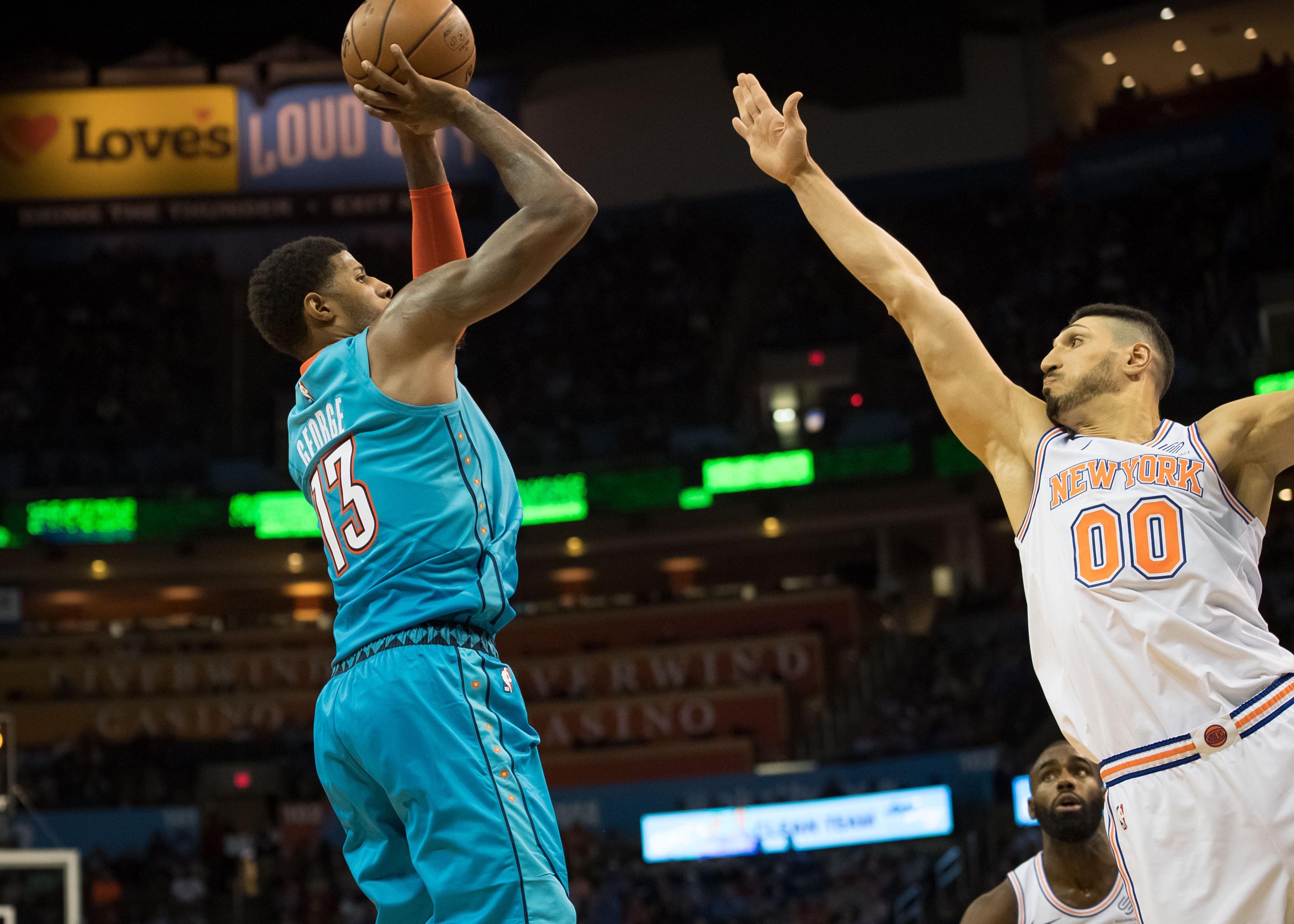 Nov 14, 2018; Oklahoma City, OK, USA; Oklahoma City Thunder forward Paul George (13) shoots the ball over New York Knicks center Enes Kanter (00) during the second half at Chesapeake Energy Arena. Mandatory Credit: Rob Ferguson-USA TODAY Sports / Rob Ferguson