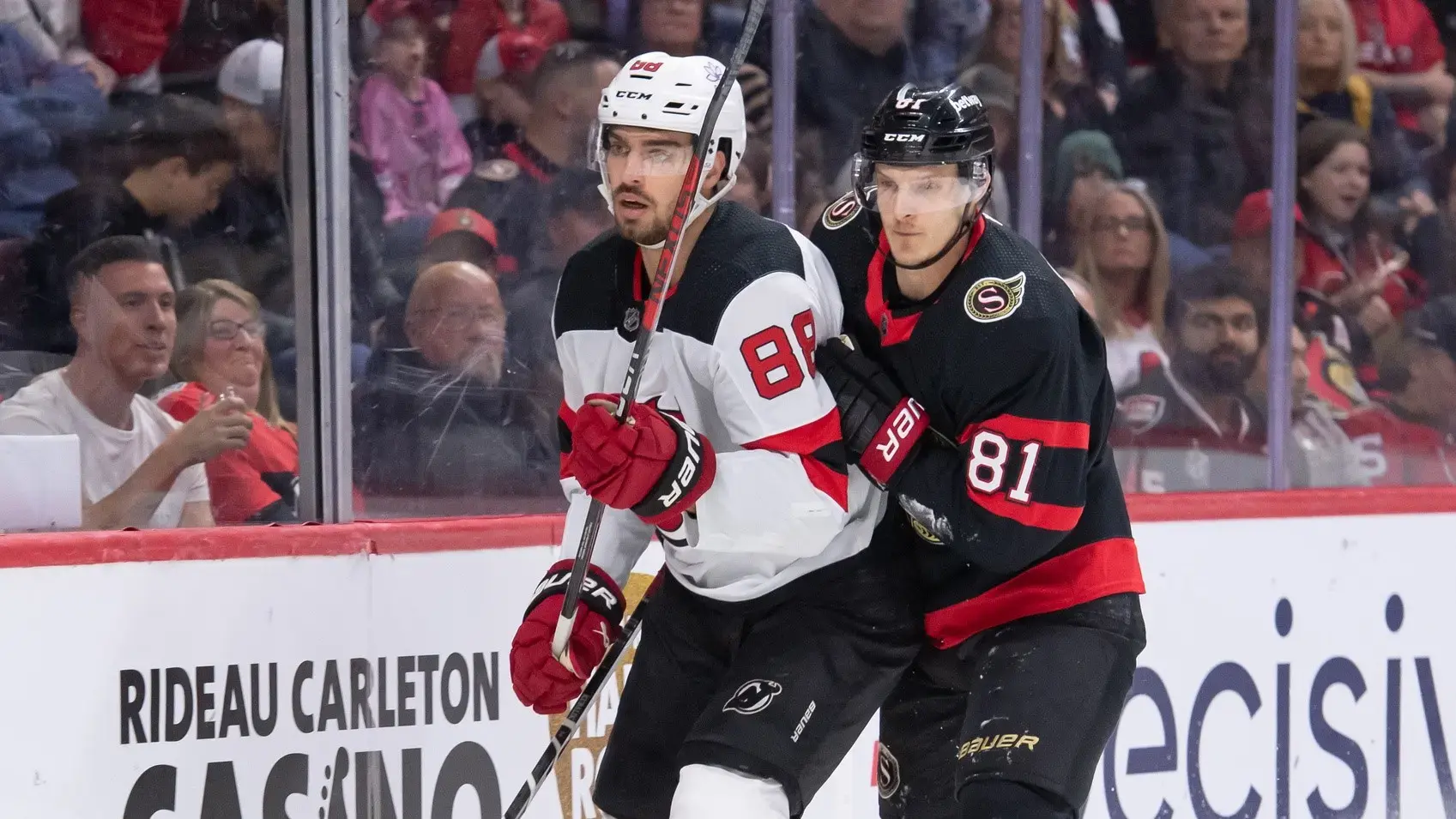 Apr 6, 2024; Ottawa, Ontario, CAN; New Jersey Devils defenseman Kevin Bahl (88) and Ottawa Senators left wing Dominik Kubalik (81) follow the puck in the first period at the Canadian Tire Centre. / Marc DesRosiers-USA TODAY Sports