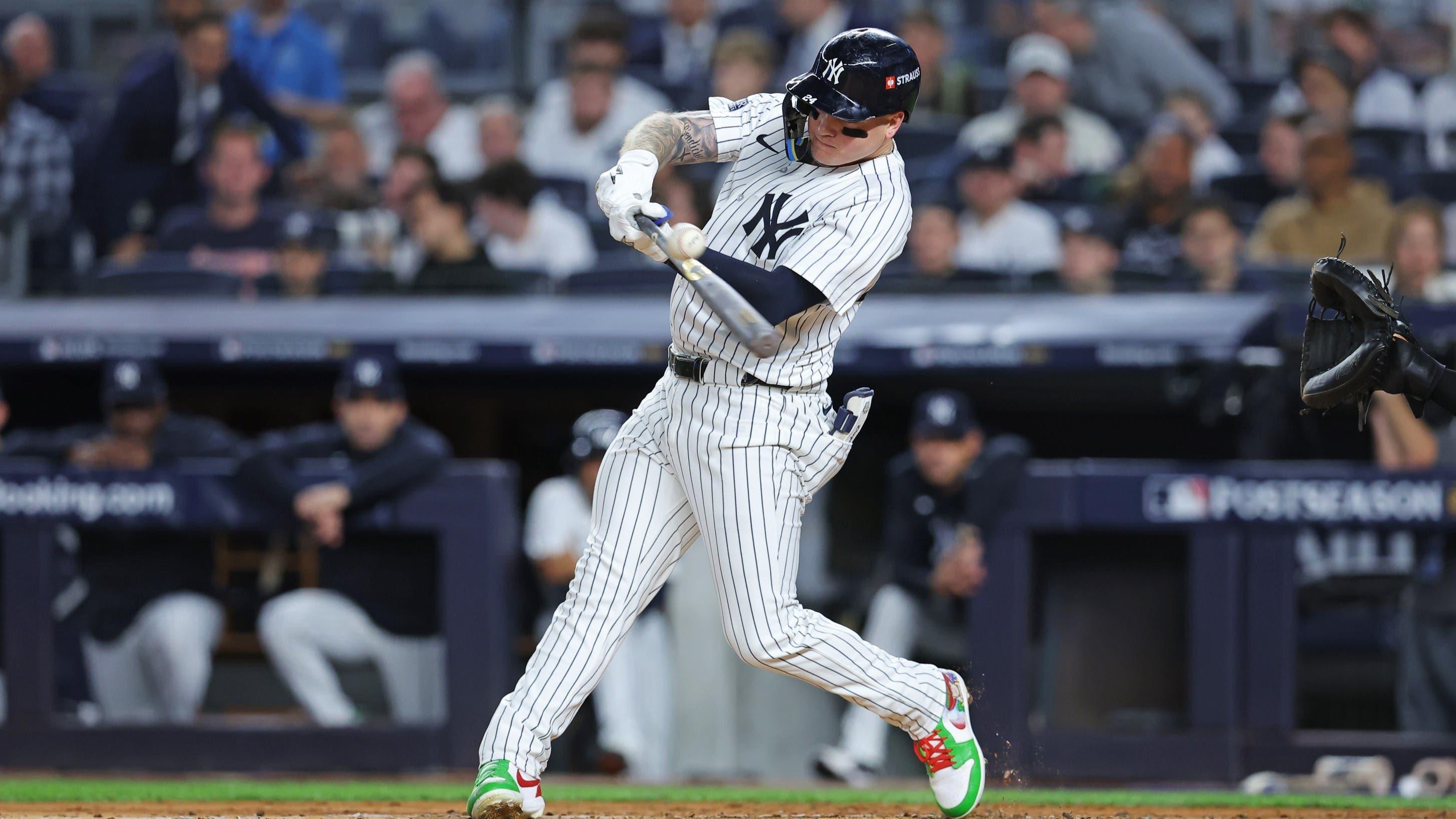 Oct 5, 2024; Bronx, New York, USA; New York Yankees outfielder Alex Verdugo (24) hits a single during the third inning against the Kansas City Royals during game one of the ALDS for the 2024 MLB Playoffs at Yankee Stadium. 