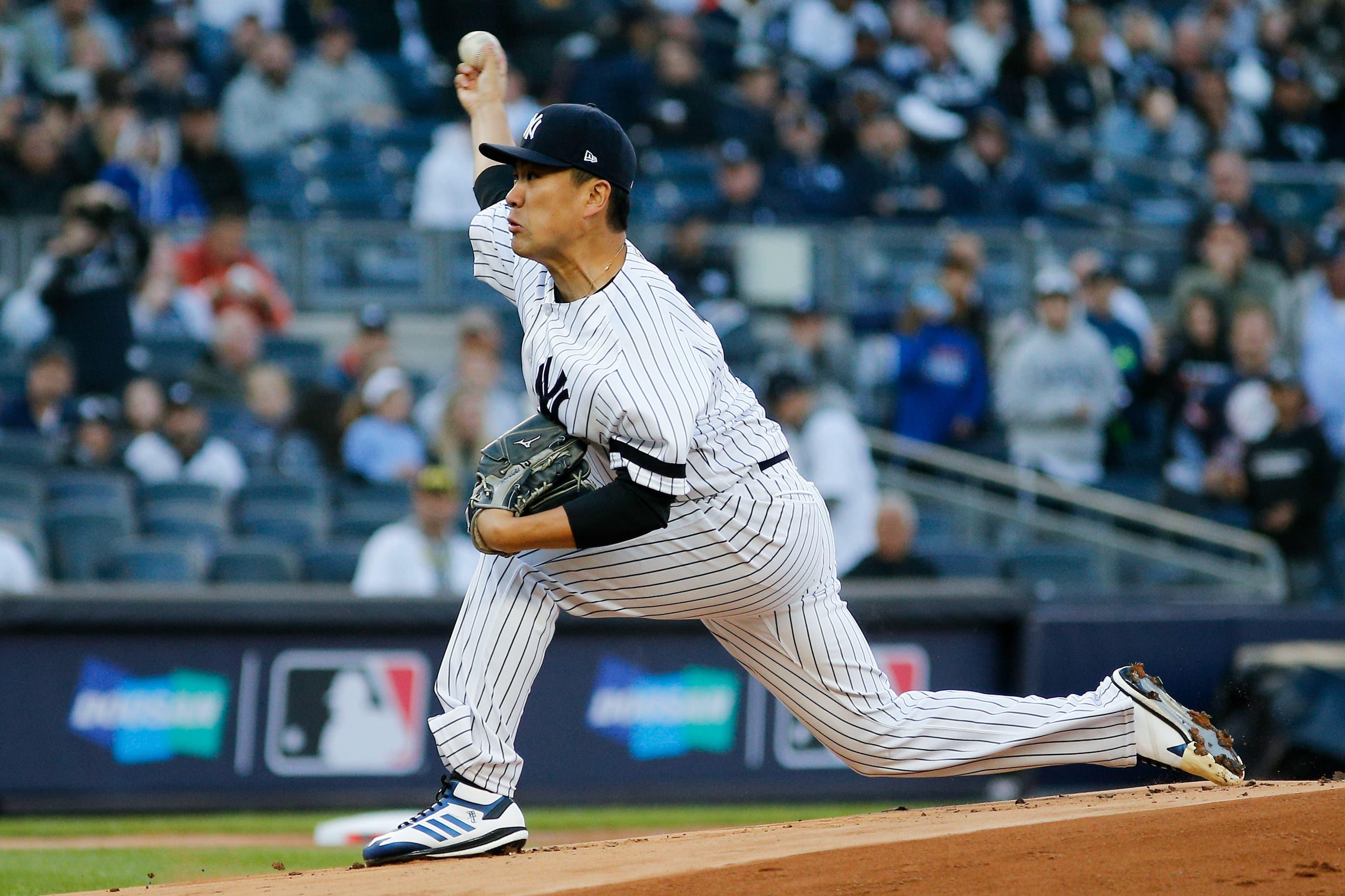 Oct 5, 2019; Bronx, NY, USA; New York Yankees starting pitcher Masahiro Tanaka (19) throws against the Minnesota Twins in the first inning in game two of the 2019 ALDS playoff baseball series at Yankee Stadium. Mandatory Credit: Andy Marlin-USA TODAY Sports / Andy Marlin