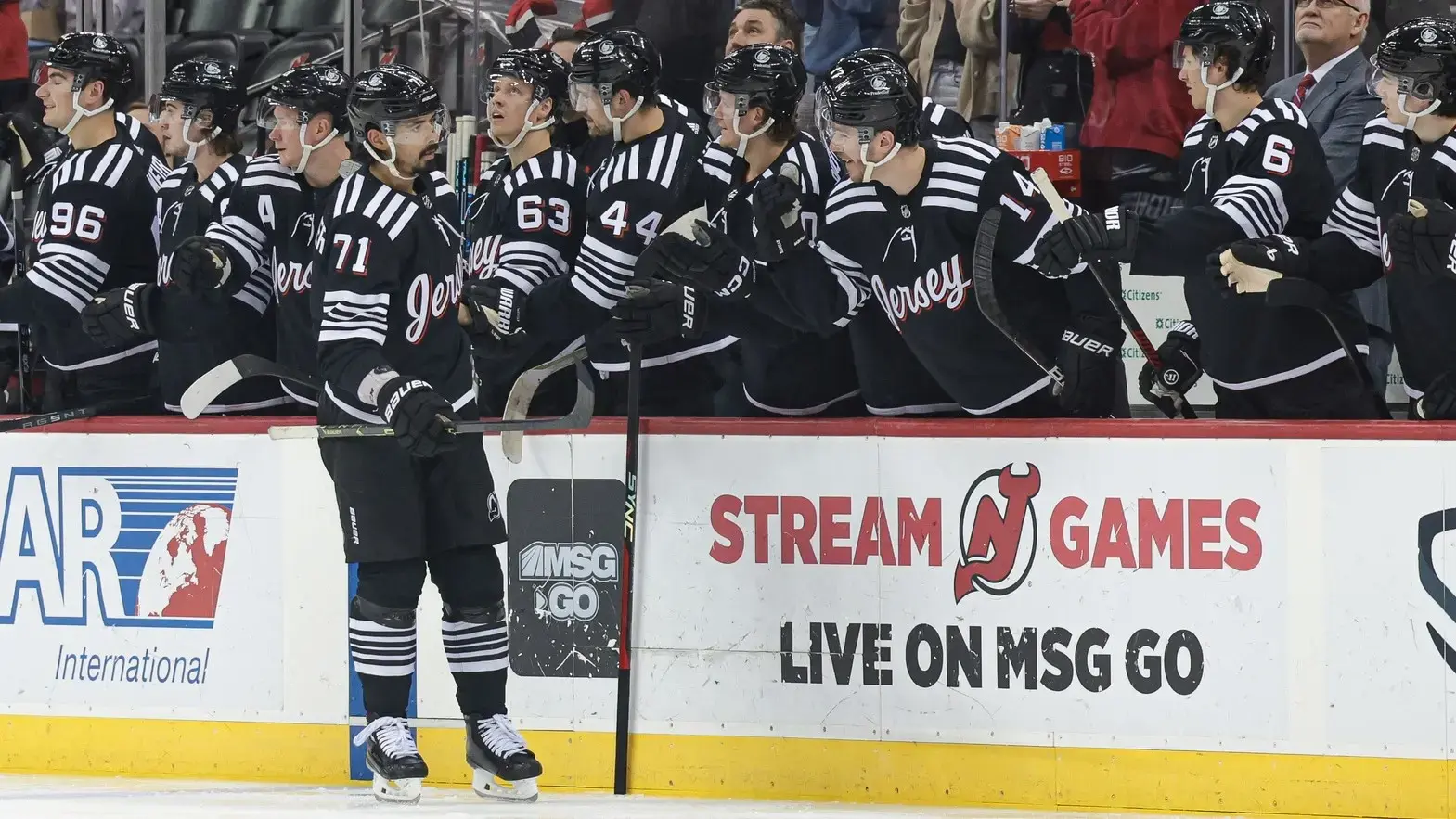 Apr 11, 2023; Newark, New Jersey, USA; New Jersey Devils defenseman Jonas Siegenthaler (71) celebrates his goal with teammates during the second period against the Buffalo Sabres at Prudential Center. / Vincent Carchietta-USA TODAY Sports