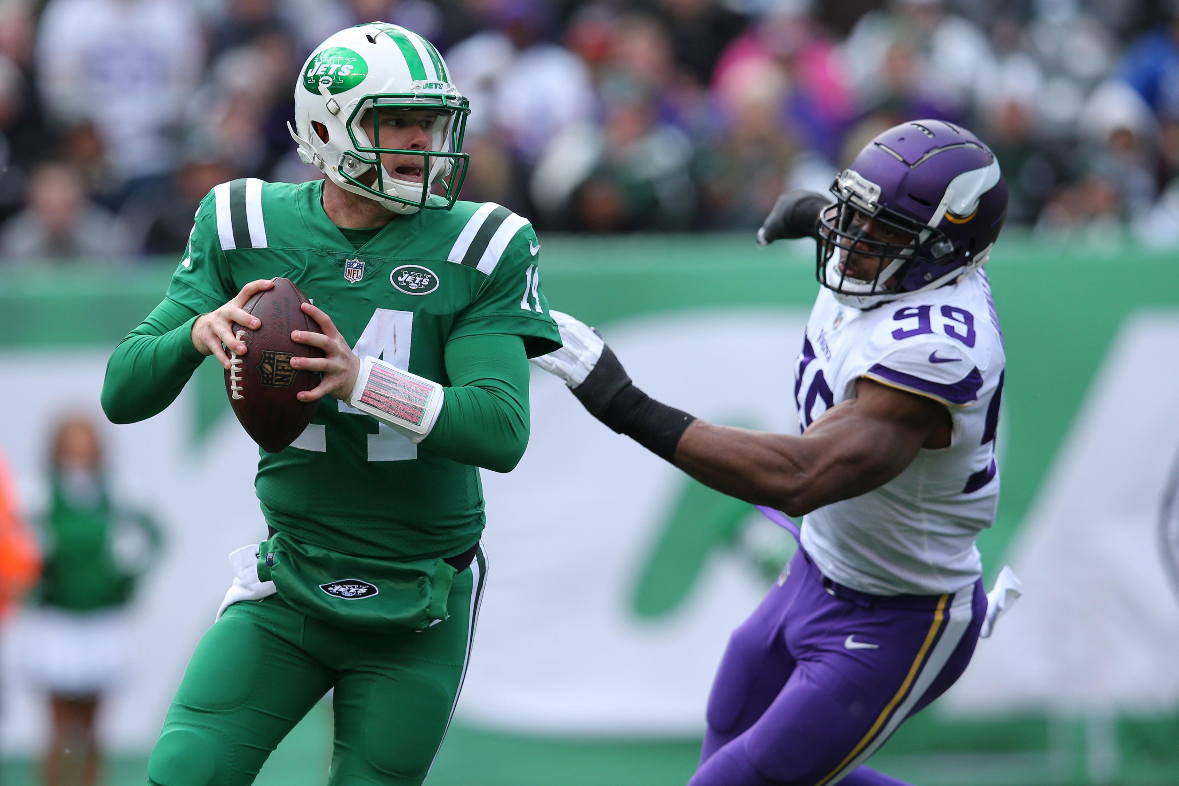 Oct 21, 2018; East Rutherford, NJ, USA; New York Jets quarterback Sam Darnold (14) scrambles from Minnesota Vikings defensive end Danielle Hunter (99) during the second quarter at MetLife Stadium. Mandatory Credit: Brad Penner-USA TODAY Sports