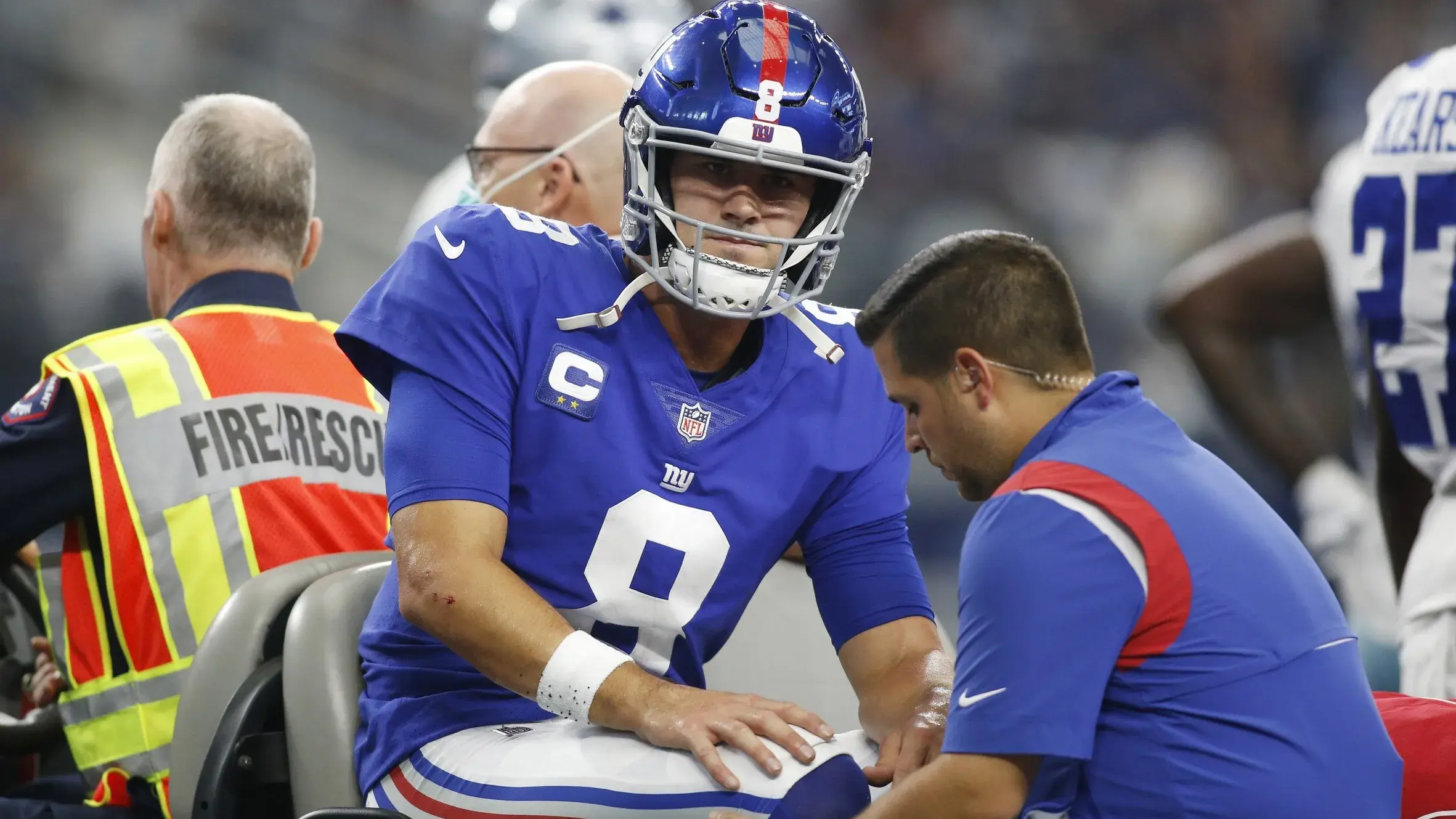 Oct 10, 2021; Arlington, Texas, USA; New York Giants quarterback Daniel Jones (8) leaves the field on a cart with an injury in the second quarter against the Dallas Cowboys at AT&T Stadium. / Tim Heitman-USA TODAY Sports
