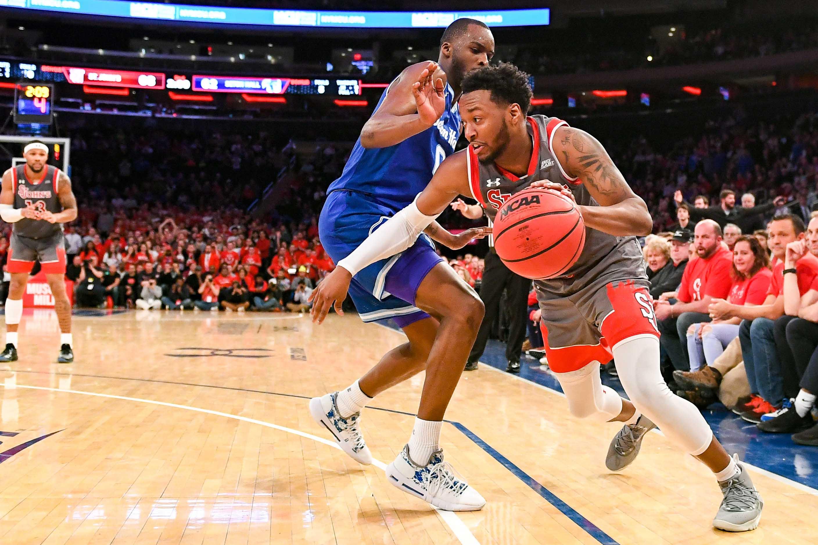 Feb 23, 2019; Queens, NY, USA; St. John's Red Storm guard Shamorie Ponds (2) drives to the basket on Seton Hall Pirates guard Quincy McKnight (0) during the second half at Madison Square Garden. Mandatory Credit: Dennis Schneidler-USA TODAY Sports / Dennis Schneidler