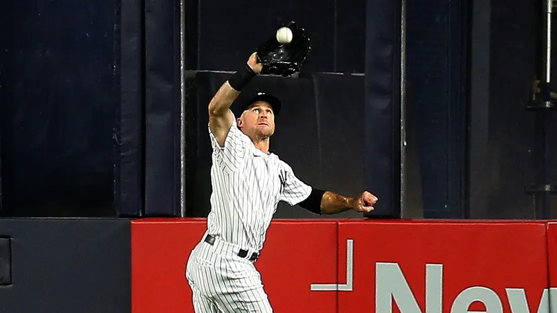 Oct 1, 2021; Bronx, New York, USA; New York Yankees center fielder Brett Gardner (11) makes a running catch against the Tampa Bay Rays during the ninth inning at Yankee Stadium. Mandatory Credit: Andy Marlin-USA TODAY Sports / © Andy Marlin-USA TODAY Sports