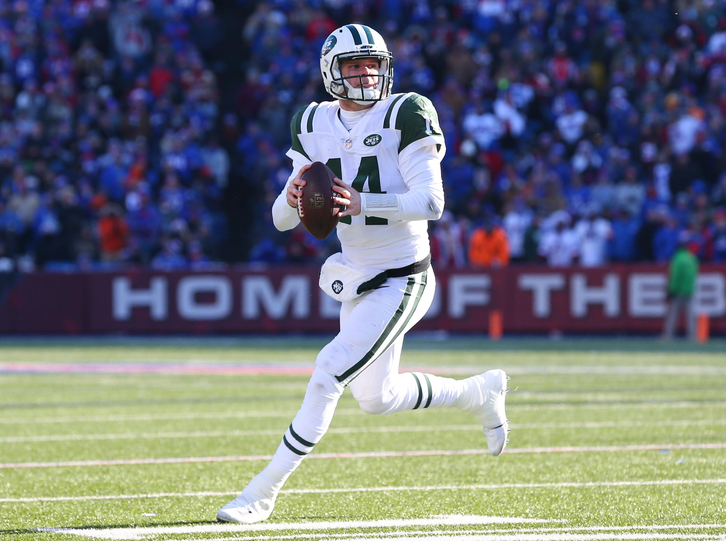 New York Jets quarterback Sam Darnold scrambles out of the pocket against the Buffalo Bills during the second quarter at New Era Field.