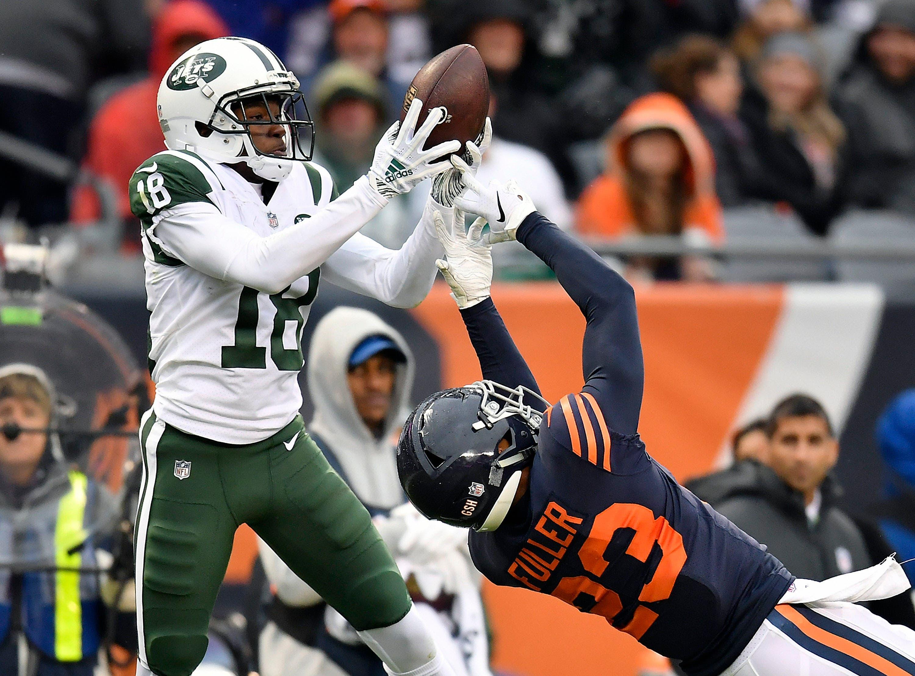 New York Jets wide receiver Deontay Burnett catches the ball against Chicago Bears cornerback Kyle Fuller at Soldier Field. / Quinn Harris/USA TODAY Sports