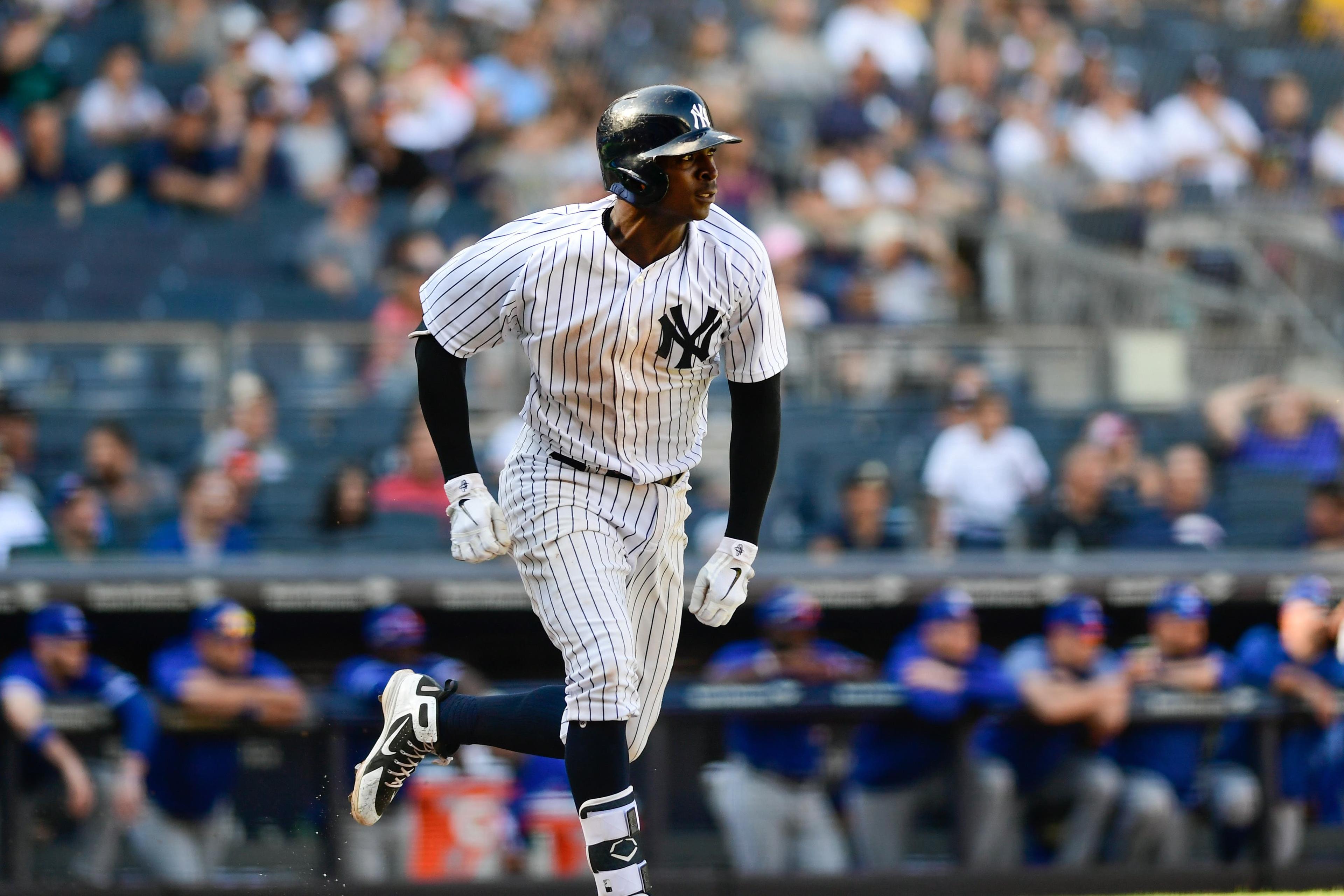 Sep 16, 2018; Bronx, NY, USA; New York Yankees shortstop DiDi Gregorius (18) hits a single to during the ninth inning against the Toronto Blue Jays at Yankee Stadium. Mandatory Credit: Catalina Fragoso-USA TODAY Sports / Catalina Fragoso