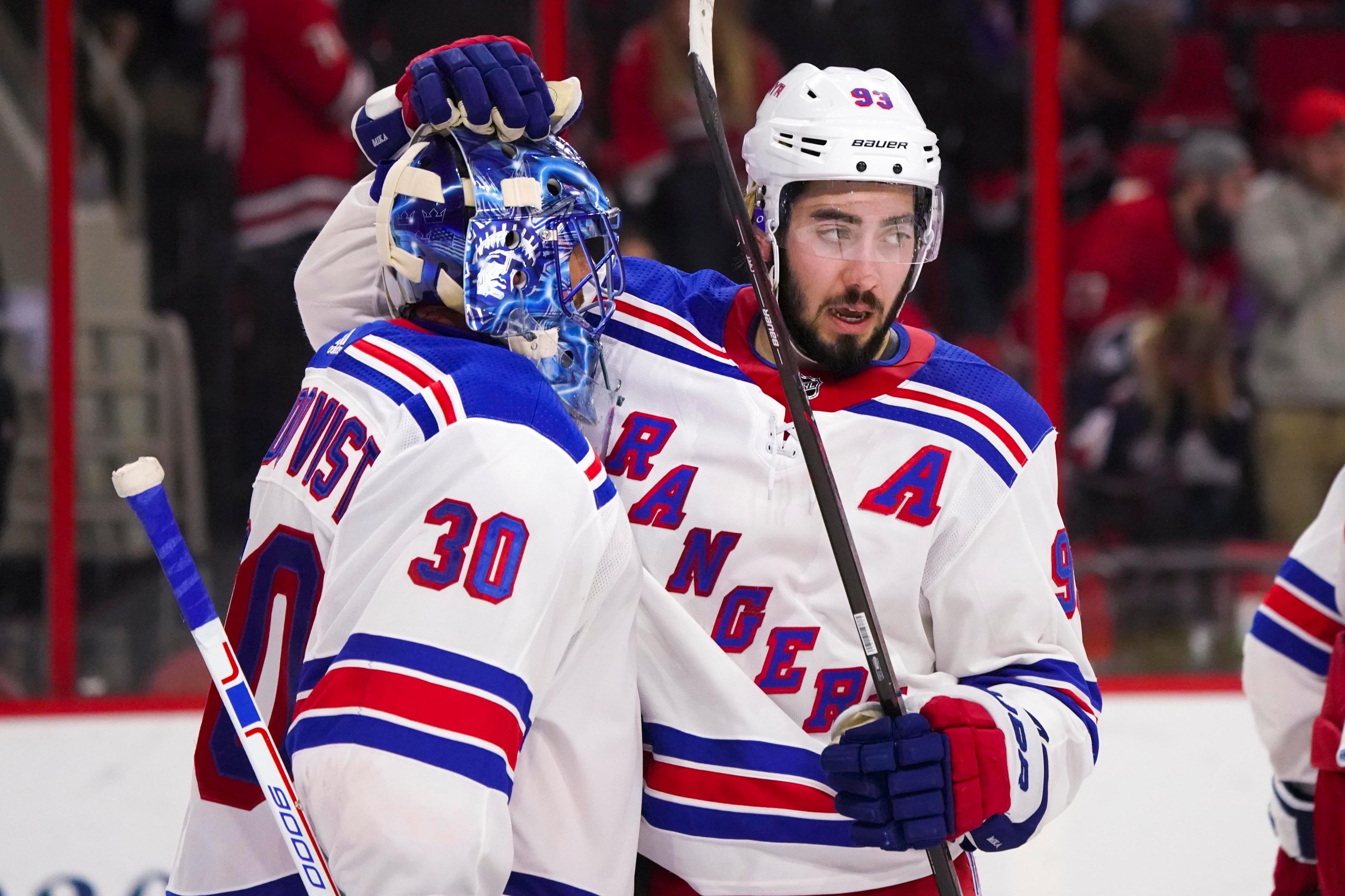 Mar 31, 2018; Raleigh, NC, USA; New York Rangers goalie Henrik Lundqvist (30) celebrates with forward Mika Zibanejad (93) after there win against the Carolina Hurricanes at PNC Arena. The New York Rangers defeated the Carolina Hurricanes 2-1. Mandatory Credit: James Guillory-USA TODAY Sports / James Guillory