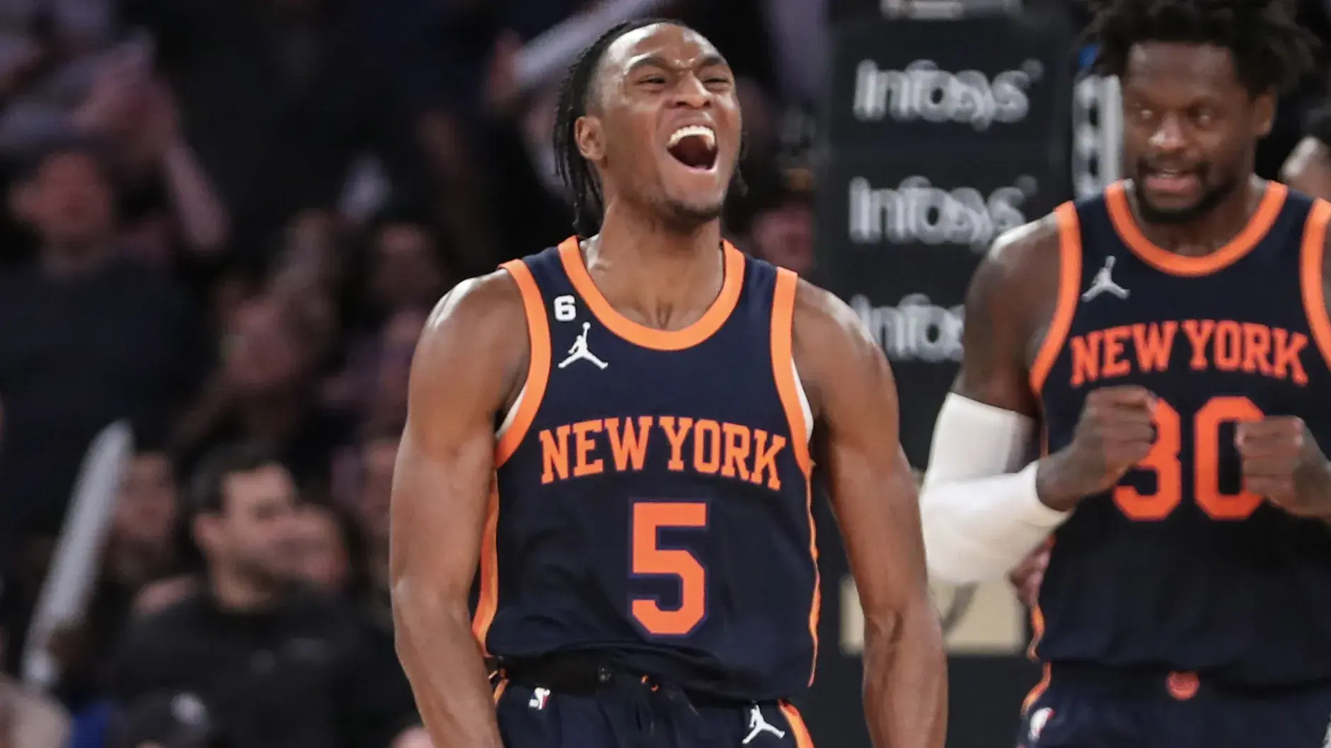 Dec 21, 2022; New York, New York, USA; New York Knicks guard Immanuel Quickley (5) celebrates after a timeout is called by the Toronto Raptors in the fourth quarter at Madison Square Garden. / Wendell Cruz-USA TODAY Sports