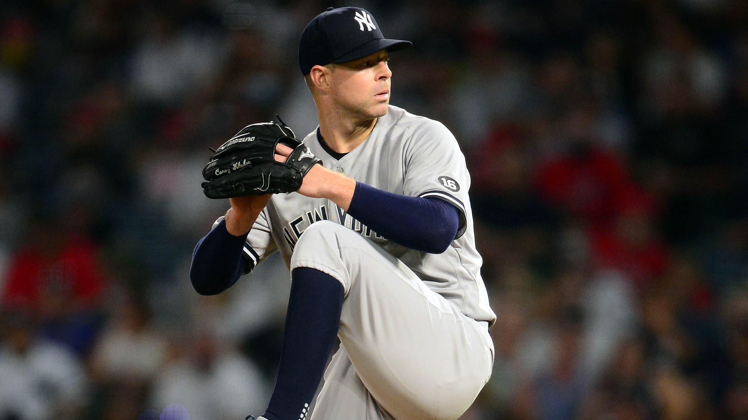 Aug 30, 2021; Anaheim, California, USA; New York Yankees starting pitcher Corey Kluber (28) throws against the Los Angeles Angels during the fourth inning at Angel Stadium. / © Gary A. Vasquez-USA TODAY Sports