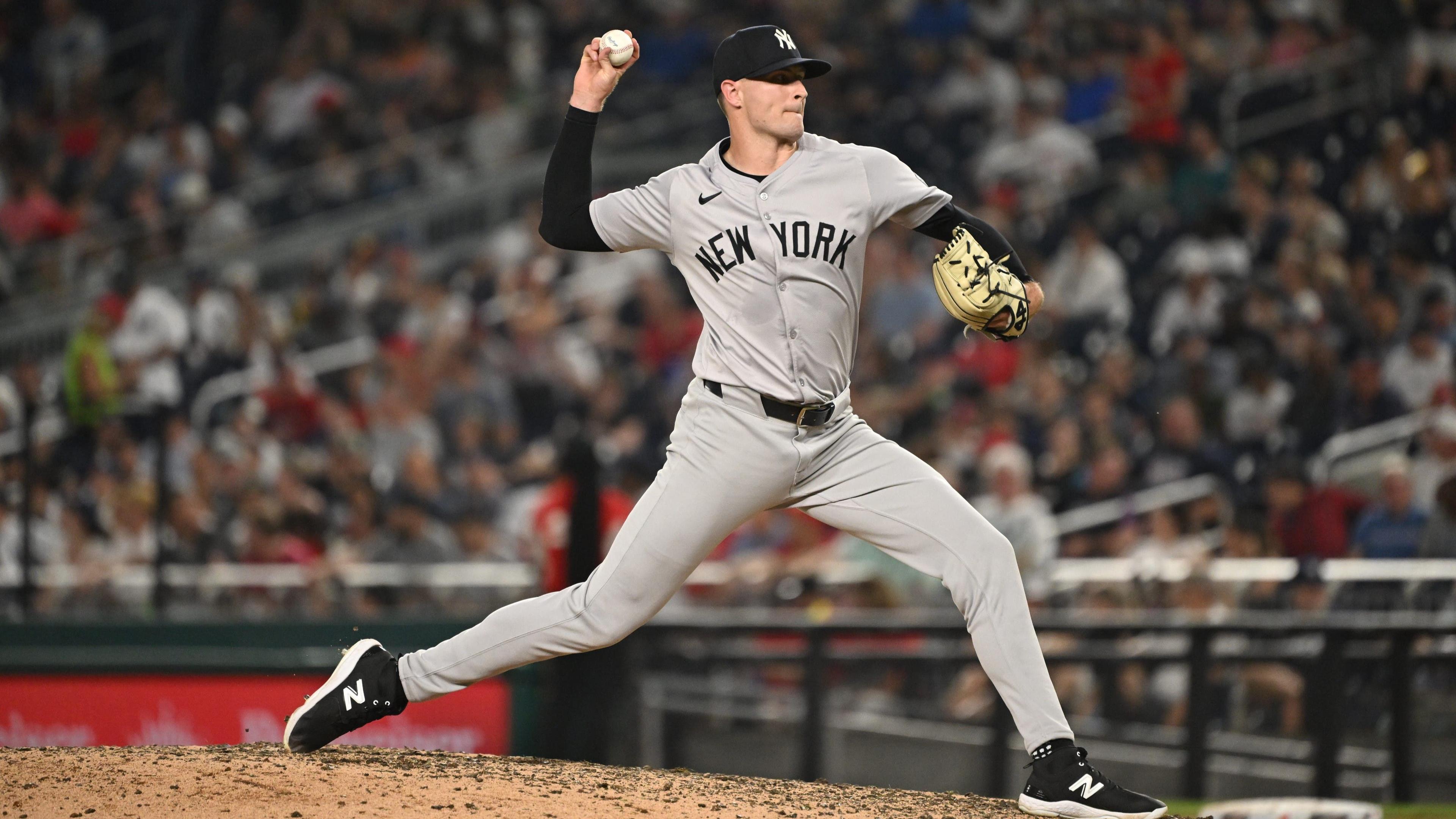 Aug 28, 2024; Washington, District of Columbia, USA; New York Yankees relief pitcher Jake Cousins (61) throws a pitch against the Washington Nationals during the sixth inning at Nationals Park.