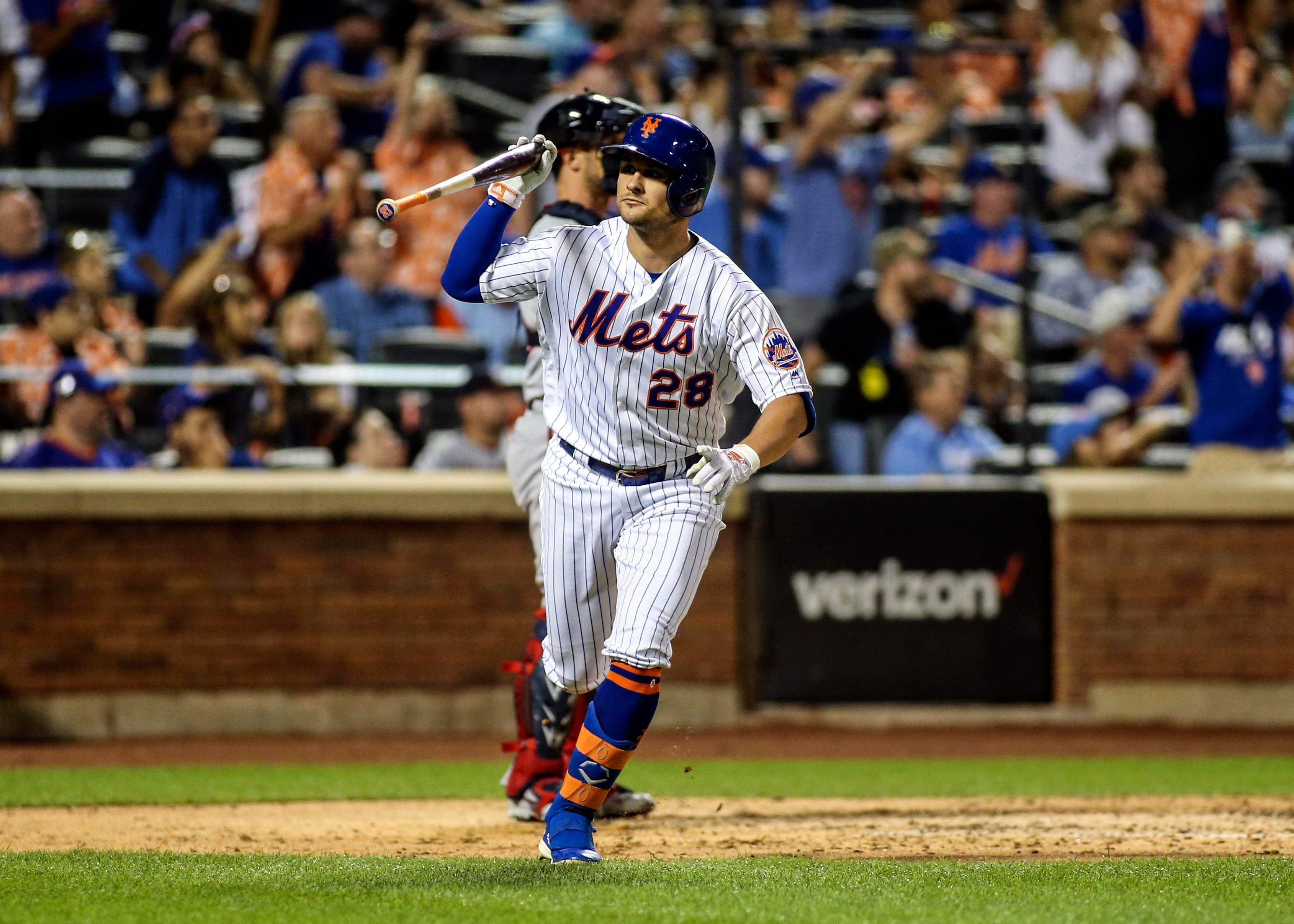 Aug 10, 2019; New York City, NY, USA; New York Mets left fielder J.D. Davis (28) flips his bat after hitting a solo home run in the fourth inning against the Washington Nationals at Citi Field. Mandatory Credit: Wendell Cruz-USA TODAY Sports / Wendell Cruz