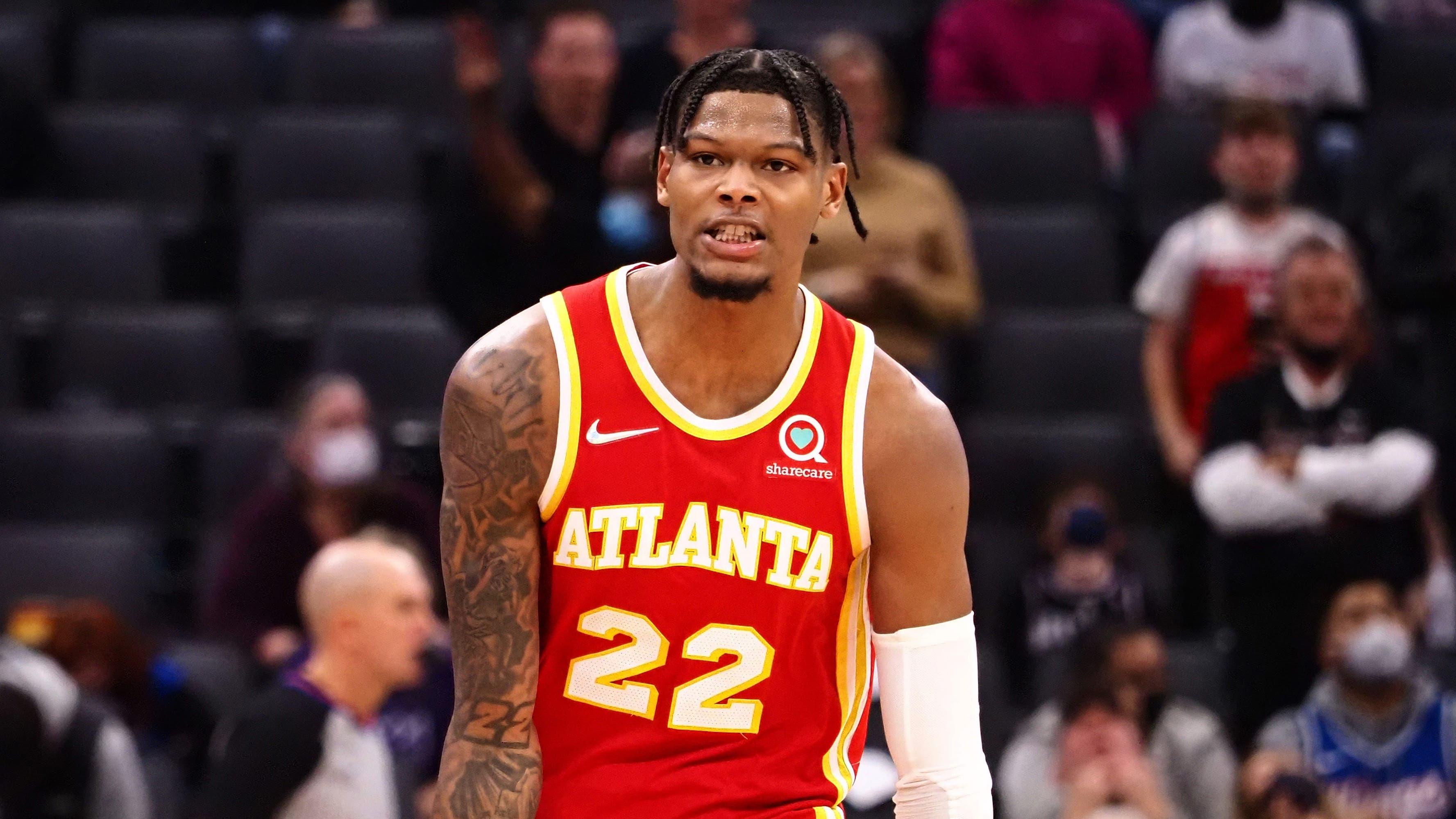 Jan 5, 2022; Sacramento, California, USA; Atlanta Hawks forward Cam Reddish (22) celebrates after scoring a three point basket against the Sacramento Kings during the fourth quarter at Golden 1 Center. / Kelley L Cox-USA TODAY Sports