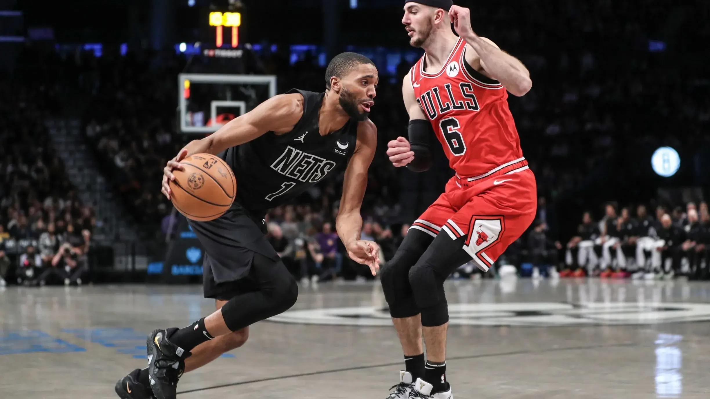 Mar 29, 2024; Brooklyn, New York, USA; Brooklyn Nets forward Mikal Bridges (1) looks to drive past Chicago Bulls guard Alex Caruso (6) in the first quarter at Barclays Center. / Wendell Cruz-USA TODAY Sports