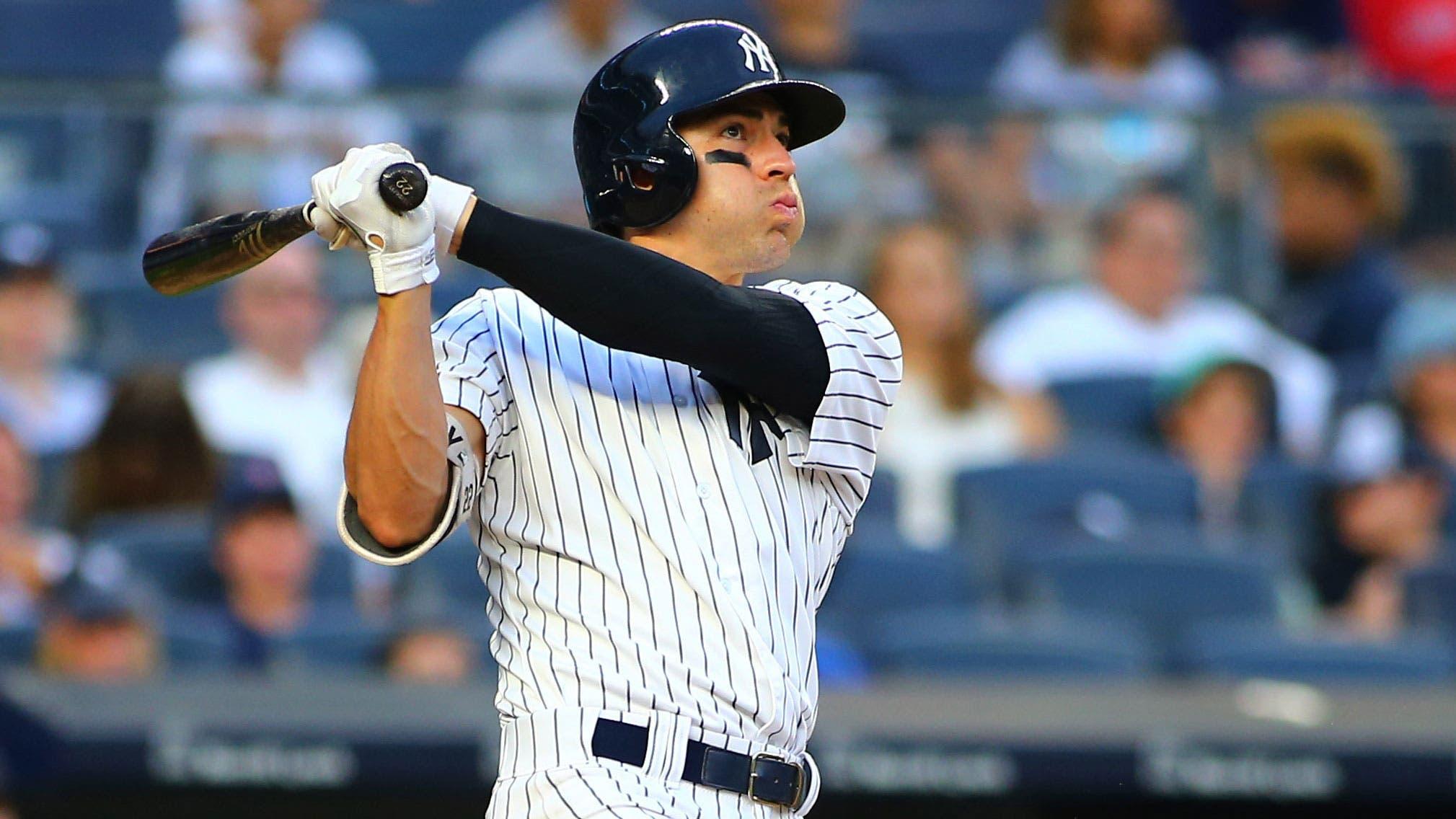 Aug 12, 2017; Bronx, NY, USA; New York Yankees center fielder Jacoby Ellsbury (22) hits a solo home run against the Boston Red Sox during the ninth inning at Yankee Stadium. / Andy Marlin-USA TODAY Sports