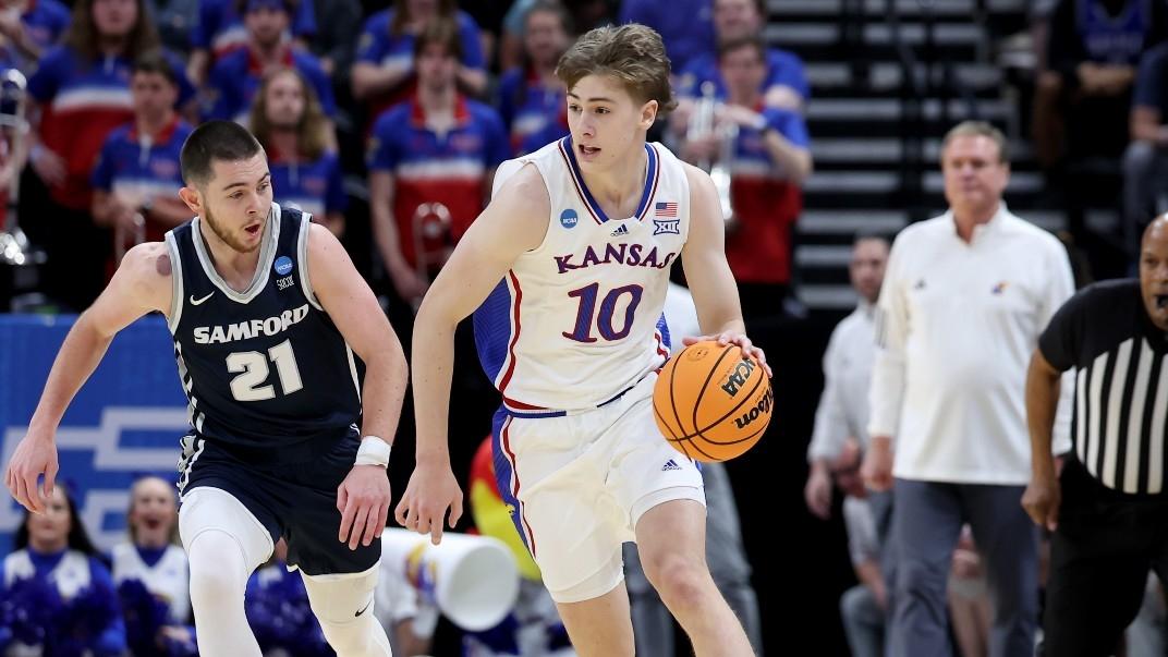 Kansas Jayhawks guard Johnny Furphy (10) dribbles against Samford Bulldogs guard Rylan Jones (21) during the first half in the first round of the 2024 NCAA Tournament at Vivint Smart Home Arena-Delta Center. / Rob Gray-USA TODAY Sports