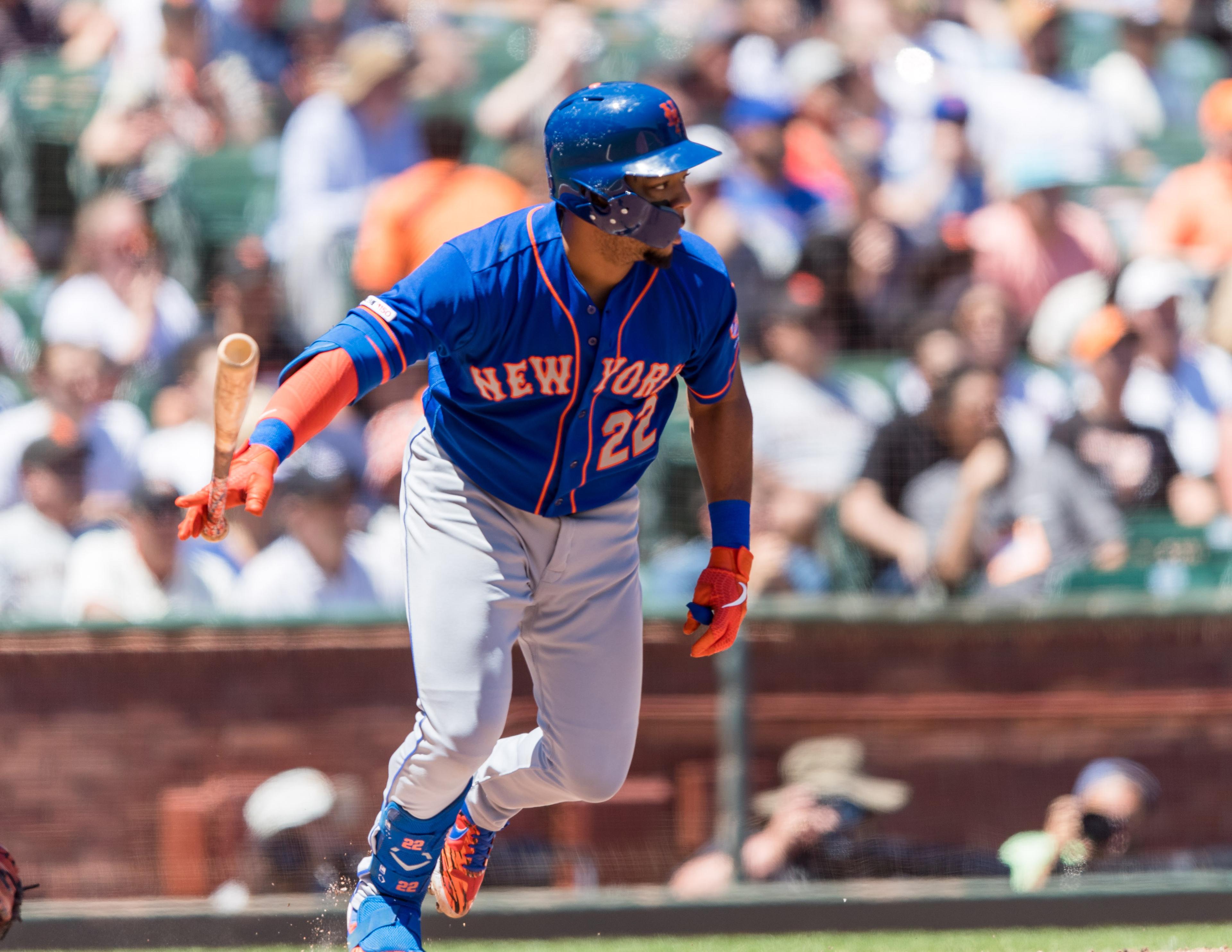 Jul 20, 2019; San Francisco, CA, USA; New York Mets first baseman Dominic Smith (22) hits an RBI single against the San Francisco Giants in the fourth inning at Oracle Park. Mandatory Credit: John Hefti-USA TODAY Sports