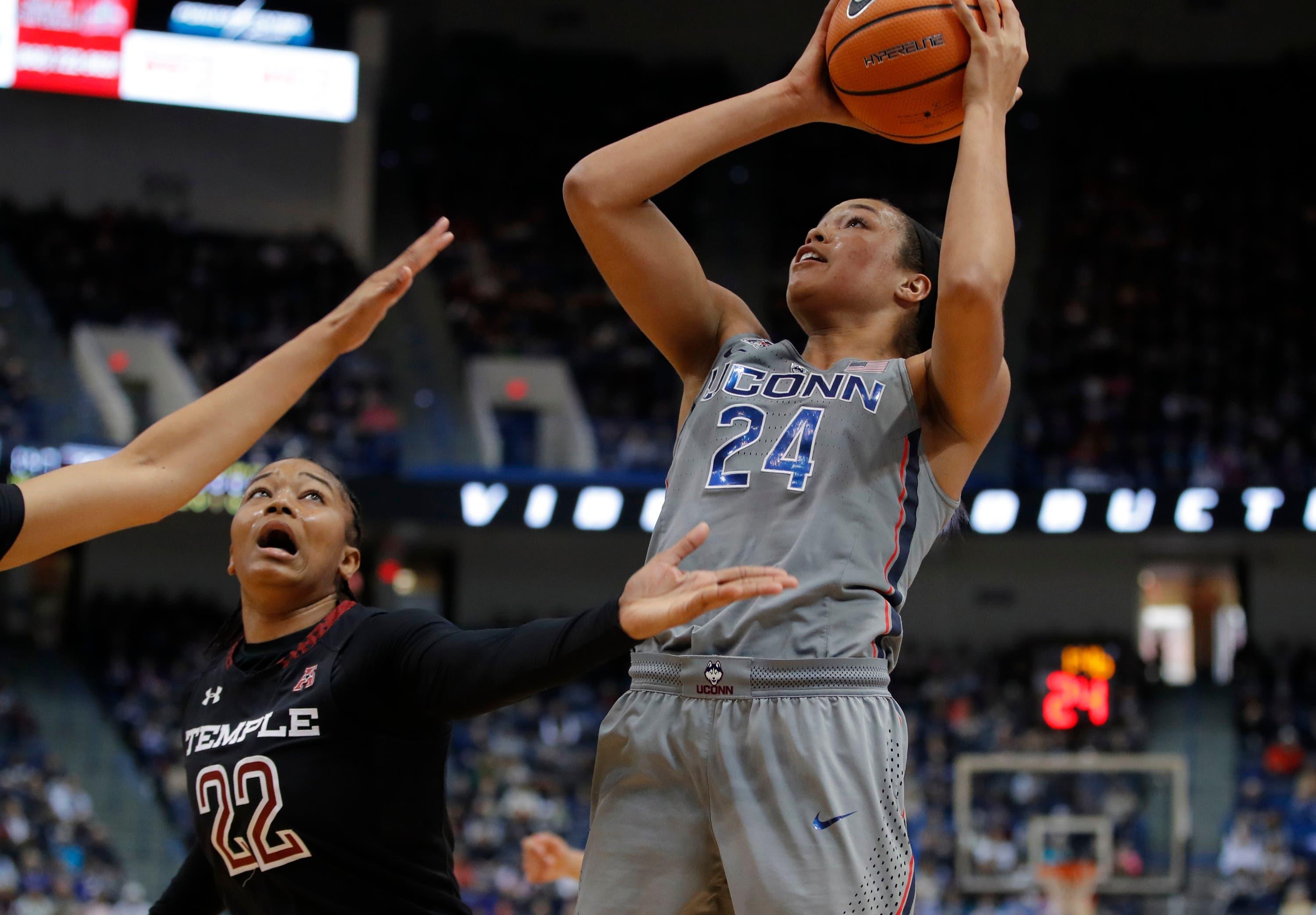 Feb 18, 2018; Hartford, CT, USA; Connecticut Huskies forward Napheesa Collier (24) shoots against Temple Owls guard Tanaya Atkinson (22) in the first half at XL Center. Mandatory Credit: David Butler II-USA TODAY Sports / David Butler II