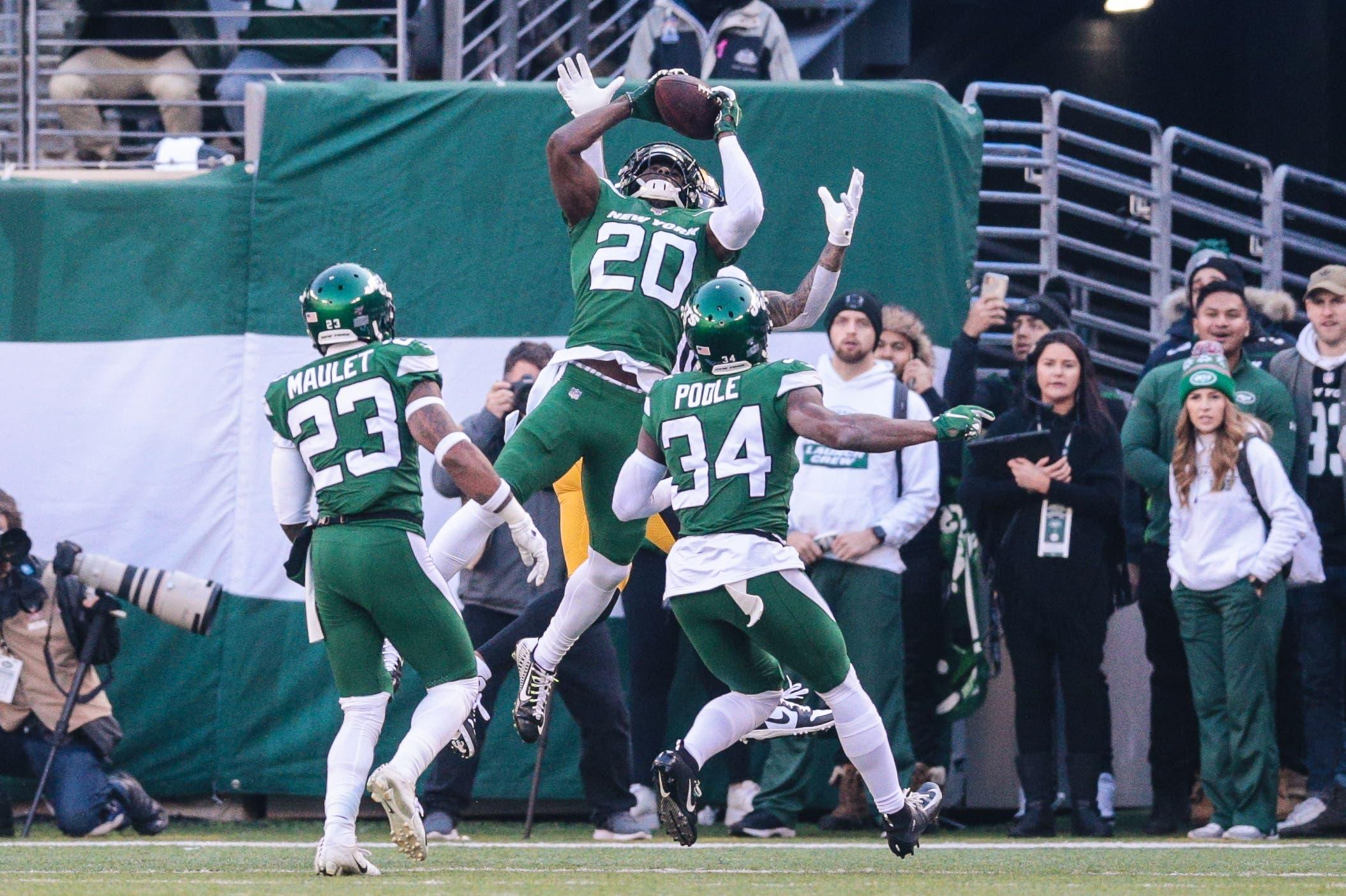 Dec 22, 2019; East Rutherford, New Jersey, USA; New York Jets free safety Marcus Maye (20) intercepts a pass in front of cornerback Brian Poole (34) and cornerback Arthur Maulet (23) during the first half against the Pittsburgh Steelers at MetLife Stadium. Mandatory Credit: Vincent Carchietta-USA TODAY Sports / Vincent Carchietta