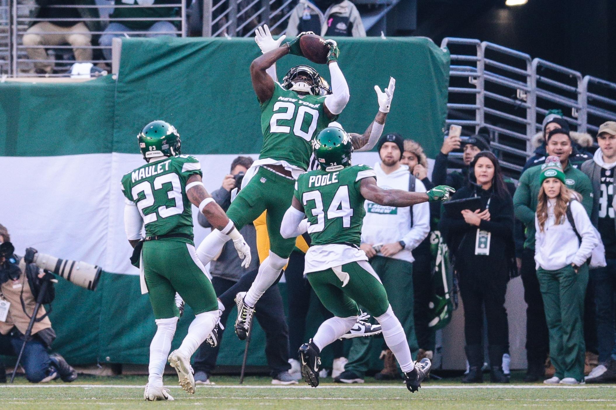 Dec 22, 2019; East Rutherford, New Jersey, USA; New York Jets free safety Marcus Maye (20) intercepts a pass in front of cornerback Brian Poole (34) and cornerback Arthur Maulet (23) during the first half against the Pittsburgh Steelers at MetLife Stadium. Mandatory Credit: Vincent Carchietta-USA TODAY Sports