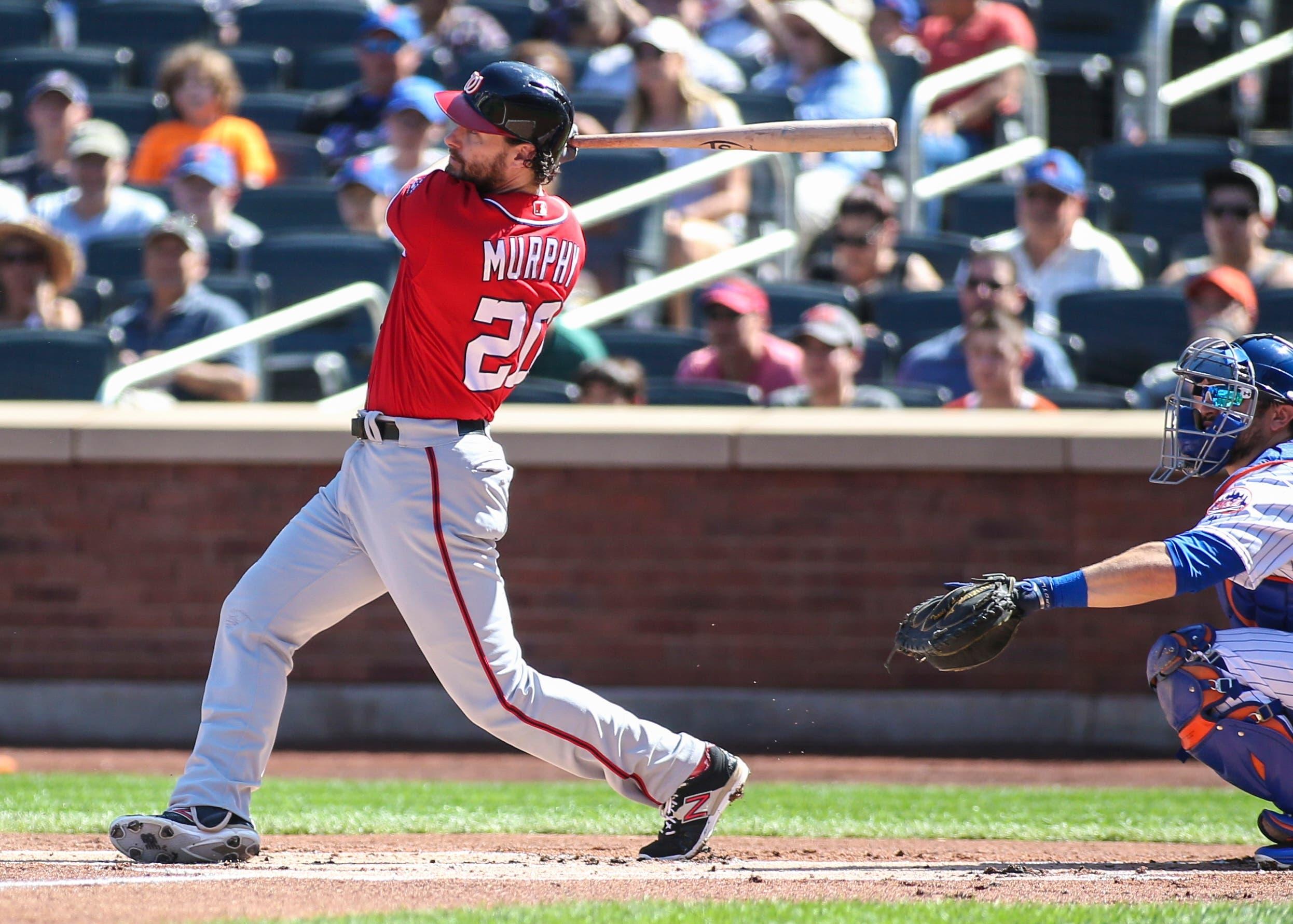 Washington Nationals second baseman Daniel Murphy (20) hits a triple in the first inning against the New York Mets at Citi Field. / Wendell Cruz-USA TODAY Sports